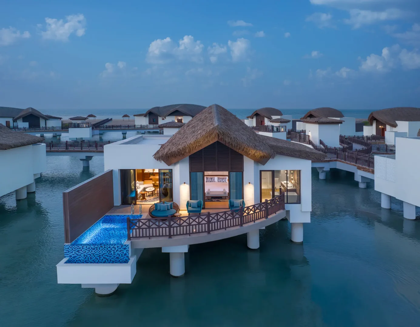 anantara mina ras al khaimah over water pool villa exterior showcasing a secluded villa set above the lagoon with uninterrupted water views