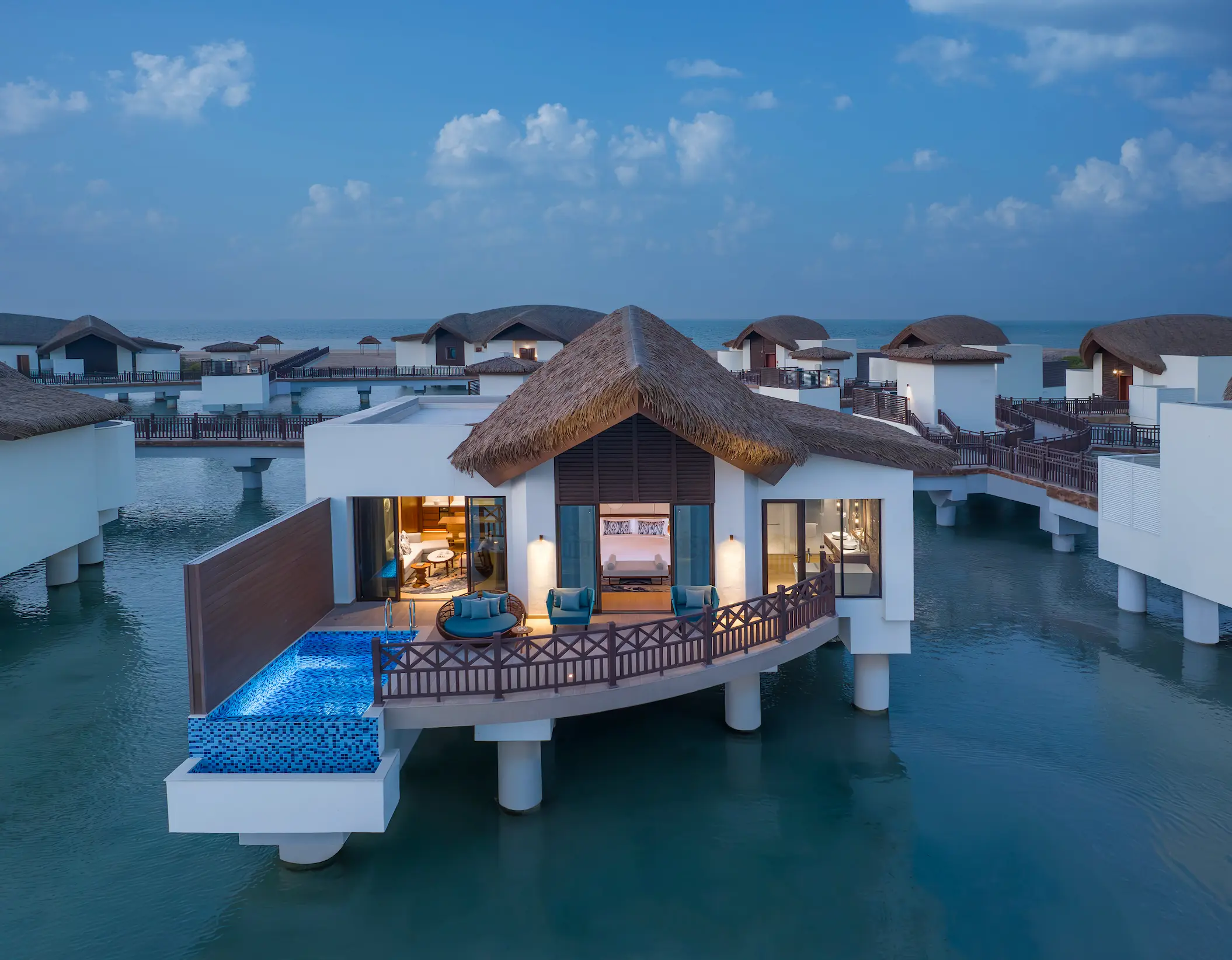 anantara mina ras al khaimah over water pool villa exterior showcasing a secluded villa set above the lagoon with uninterrupted water views