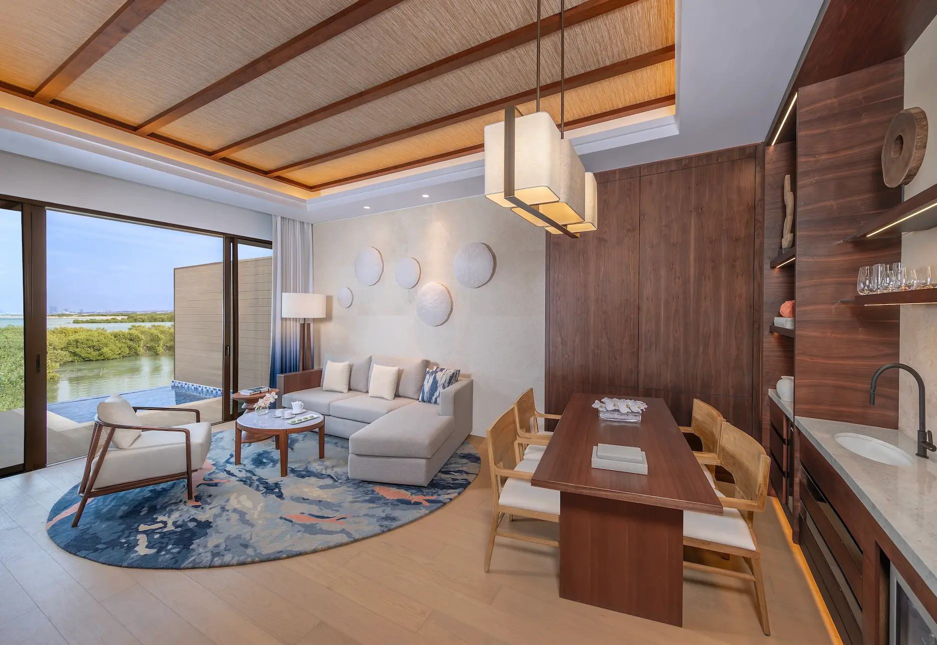anantara mina ras al khaimah over water pool villa living room featuring a spacious and elegant living area with tranquil lagoon views