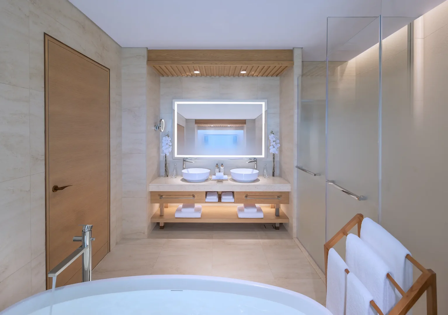 anantara mina ras al khaimah premier garden terrace room bathroom featuring a refined bathroom space serving the twin guest room with elegant finishes