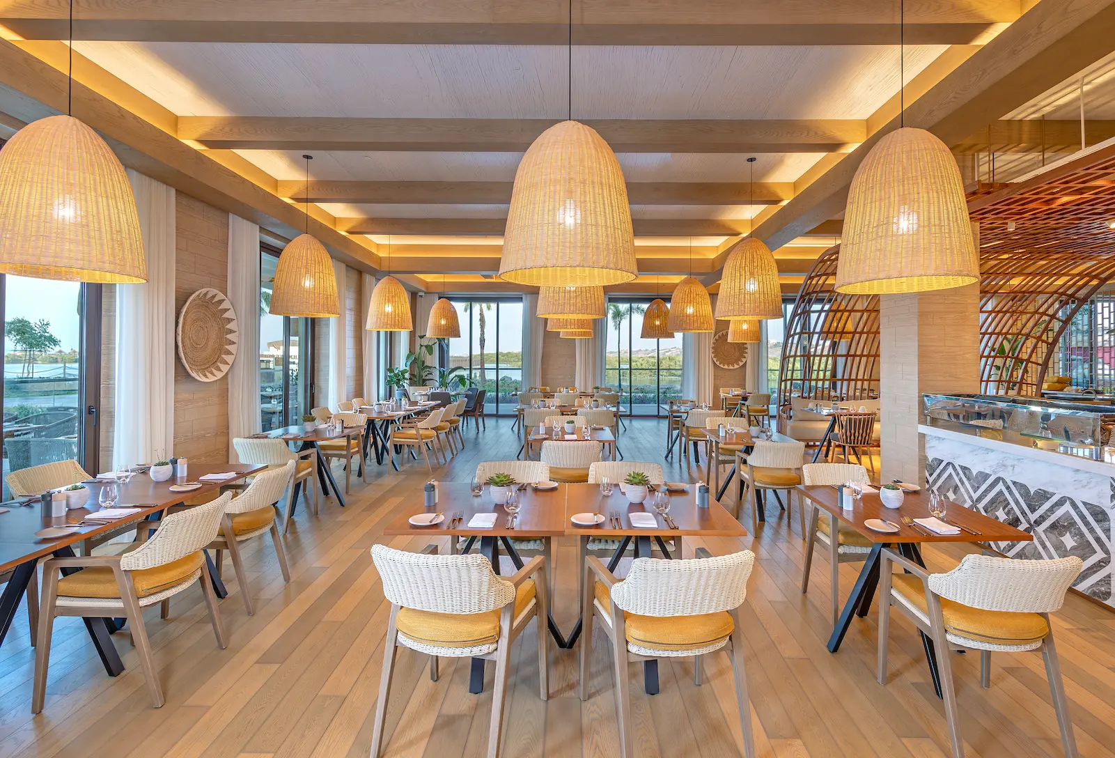 anantara mina ras al khaimah sea breeze showcasing a relaxed beachfront dining venue with open views and a fresh coastal atmosphere