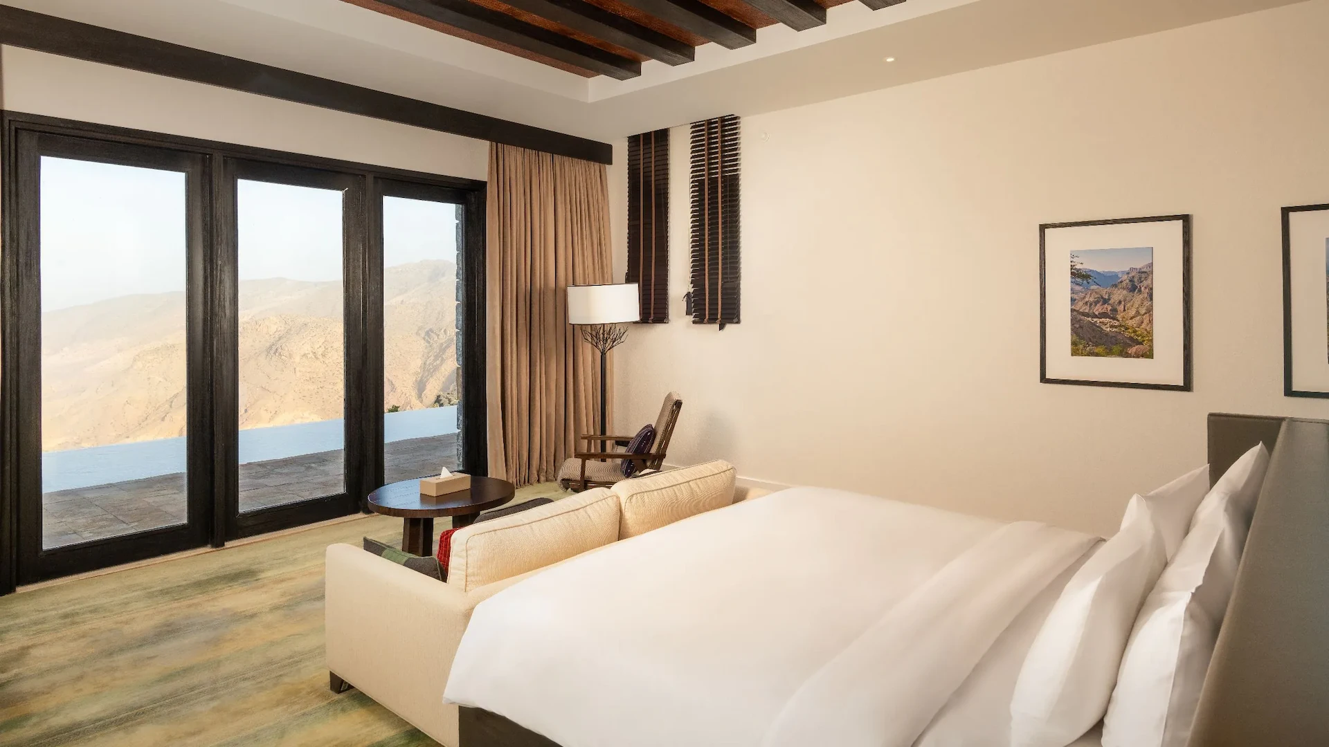bed with view in jabal villa at alila jabal akhdar oman