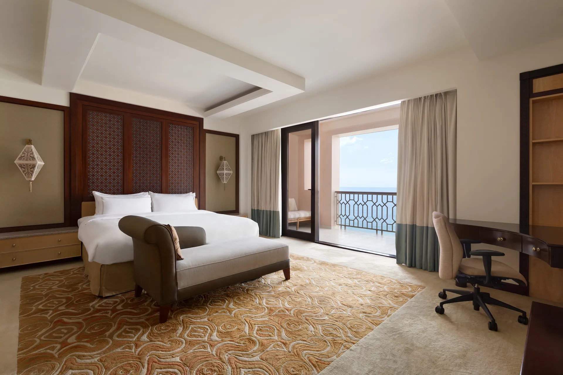 bedroom deluxe one suite with sea view al husn hotel muscat oman