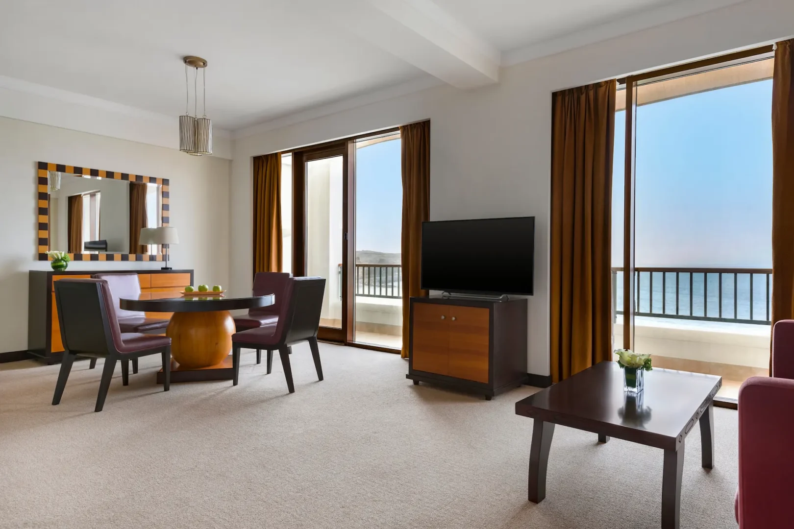 dining table on balcony in deluxe suite sea view hilton muscat al waha oman