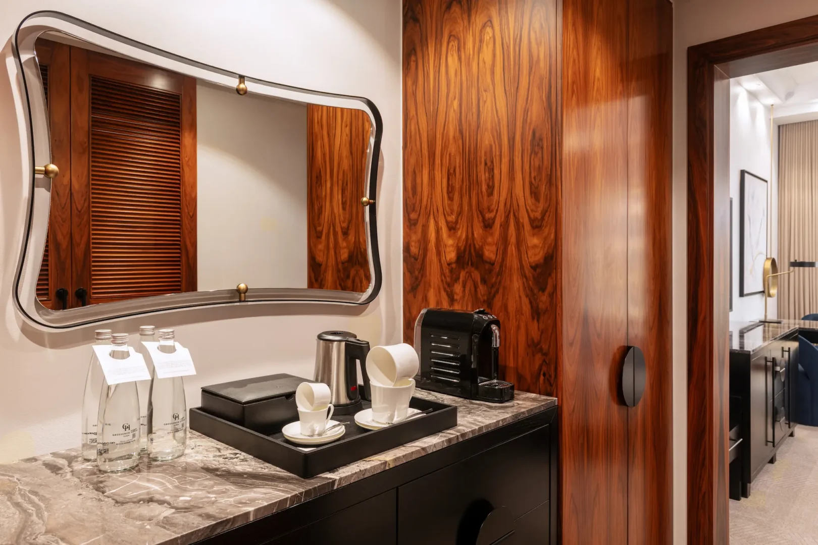 grosvenor house dubai deluxe room king bed amenities featuring curated luxury comforts and premium in room details