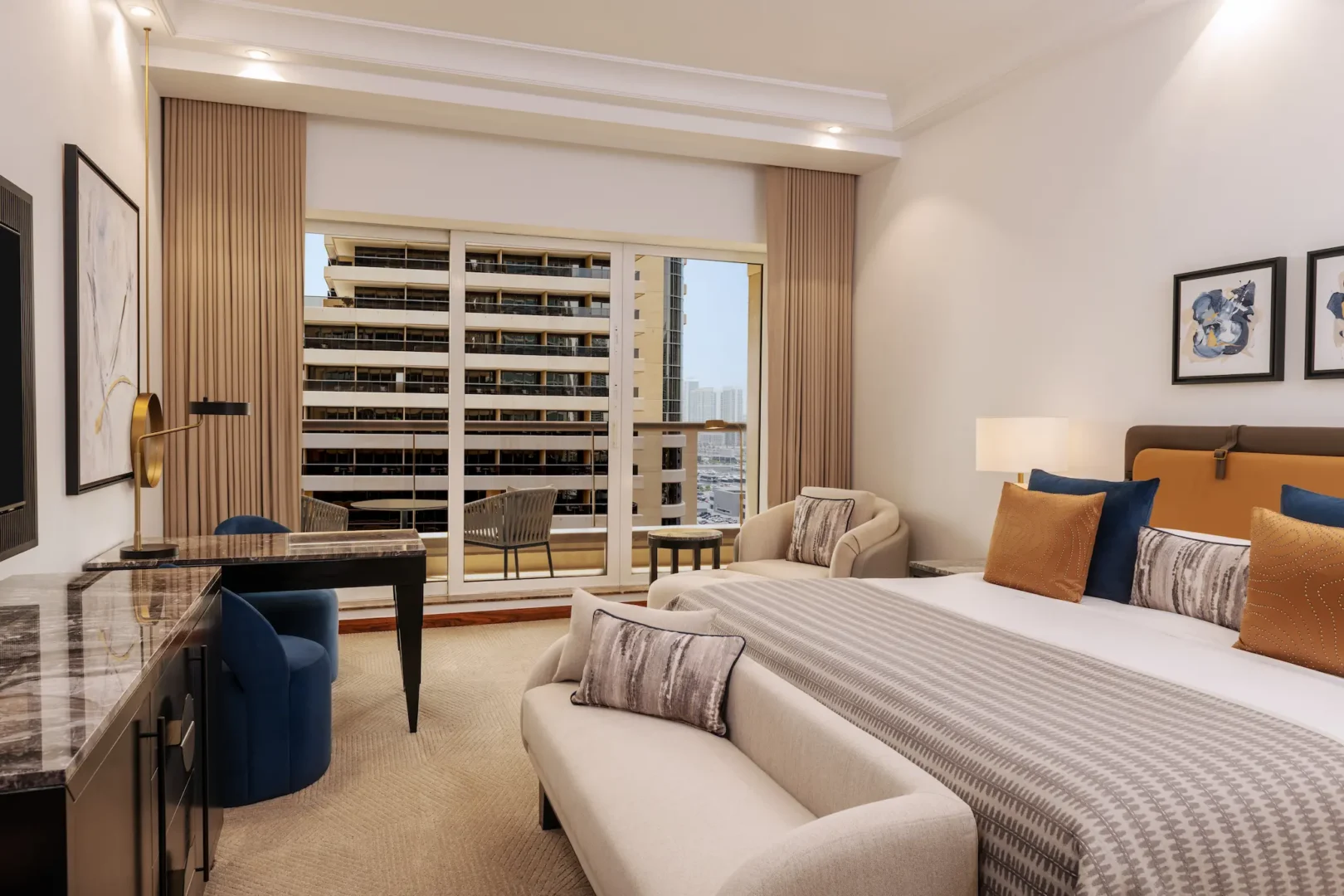 grosvenor house dubai deluxe room king bed city view overlooking the vibrant urban skyline