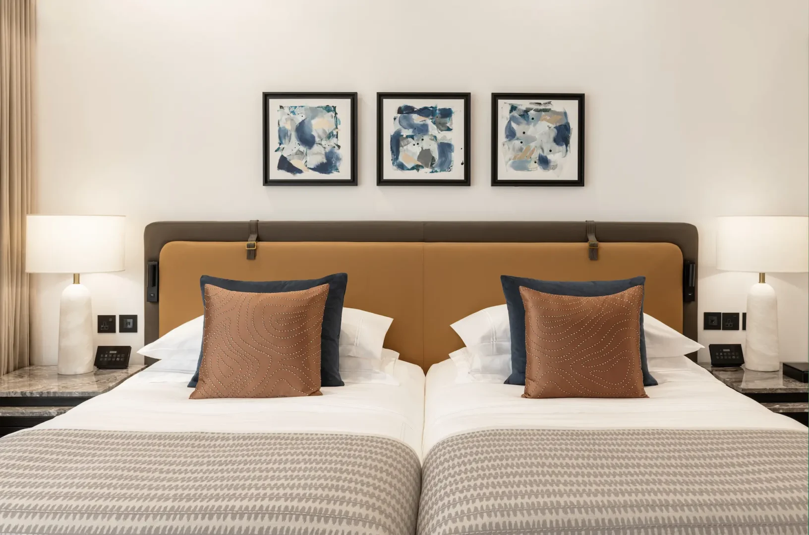 grosvenor house dubai deluxe room twin bed interior with refined luxury detailing