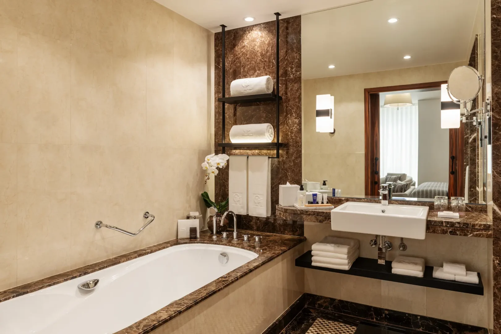 grosvenor house dubai deluxe suite bathroom featuring elegant marble finishes and refined luxury amenities