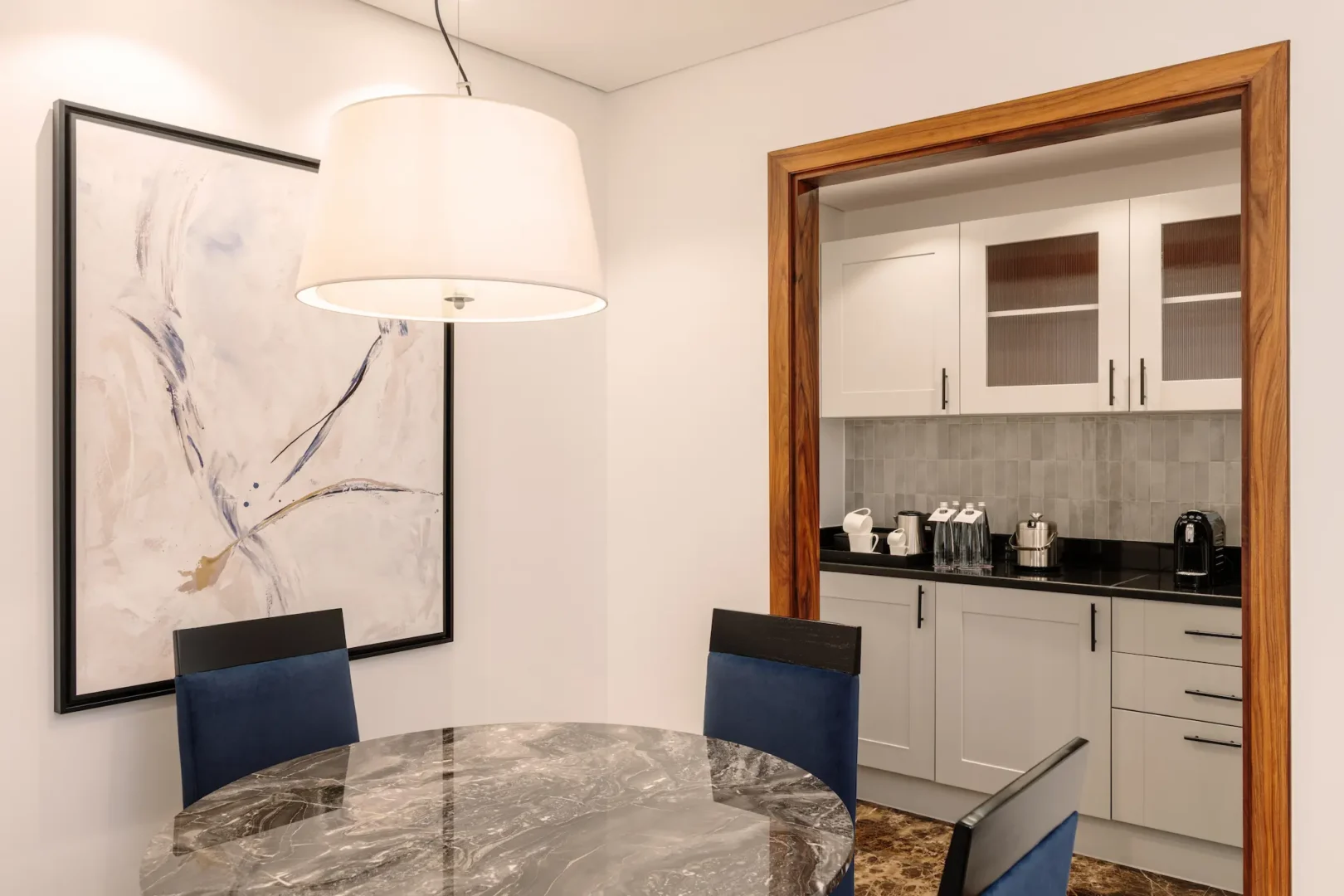 grosvenor house dubai deluxe suite dining kitchen featuring a refined open plan layout with luxury finishes