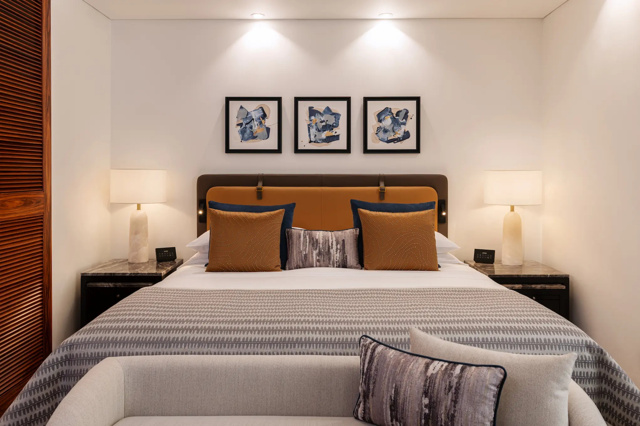 grosvenor house dubai deluxe suite king bed detail highlighting fine linens and refined luxury craftsmanship