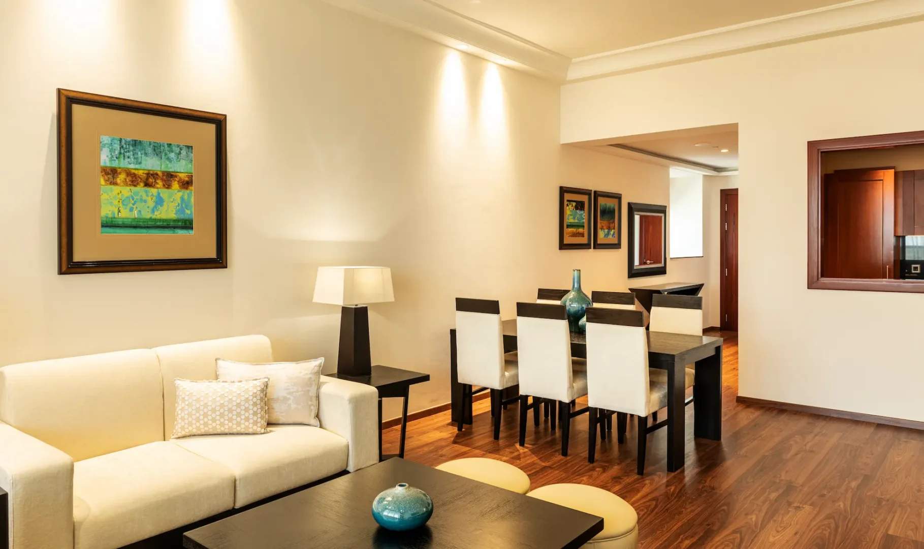 grosvenor house dubai one bed apartment lounge dining area featuring refined luxury seating and an elegant open plan layout