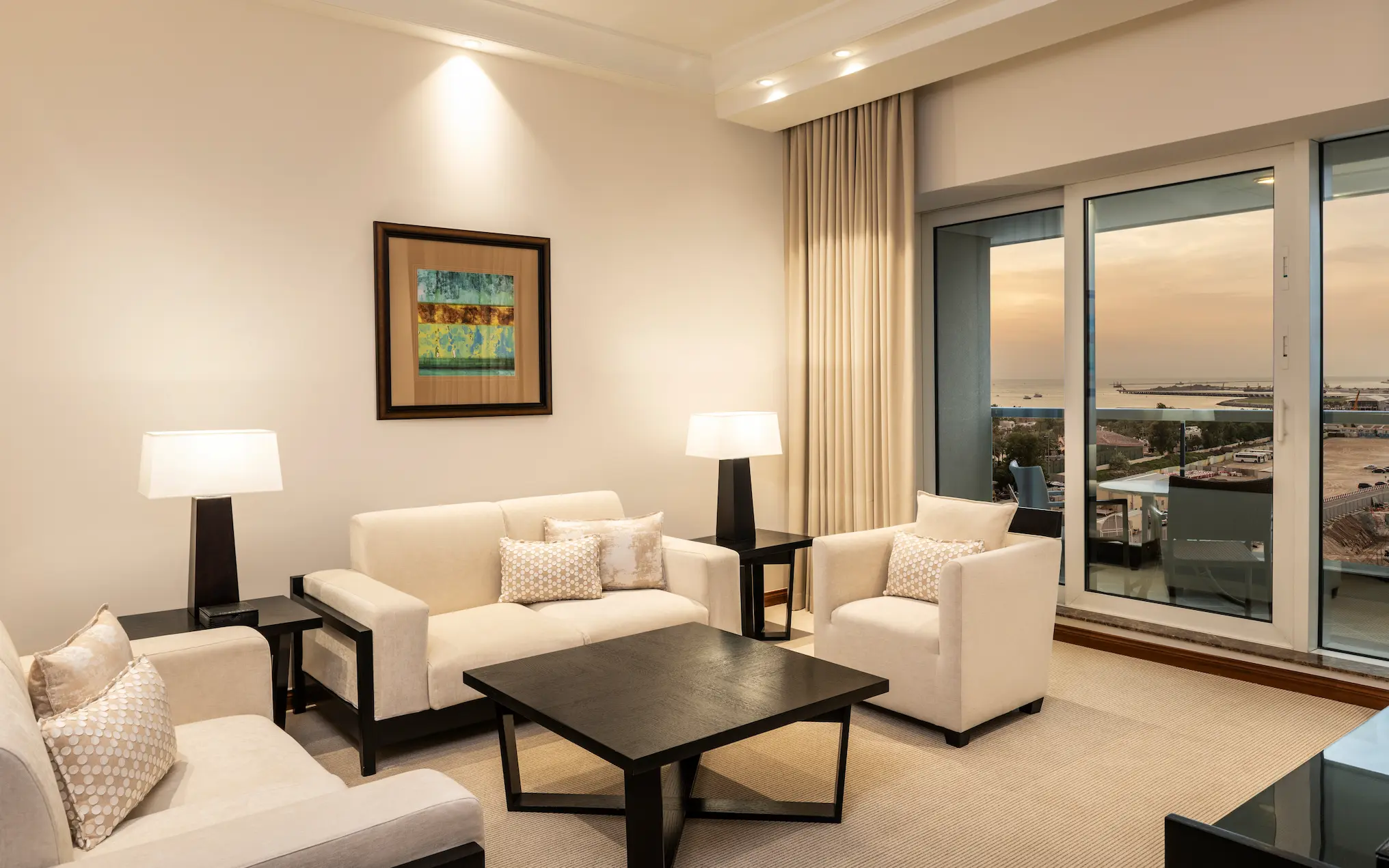 grosvenor house dubai premiere suite lounge area featuring refined luxury seating and elegant contemporary design