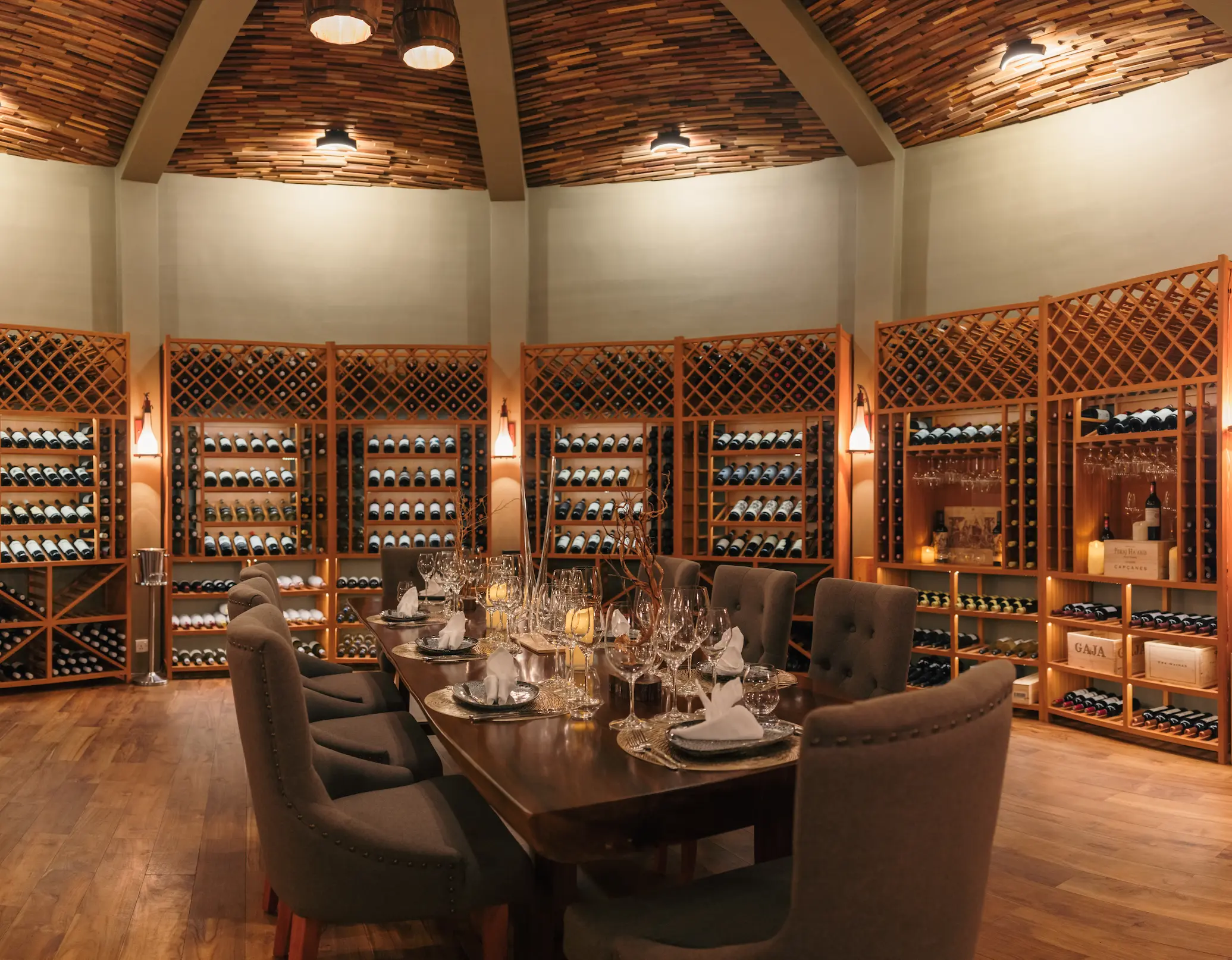 siyam world maldives barrique wine cellar offering refined gourmet dining within an intimate atmospheric underground setting