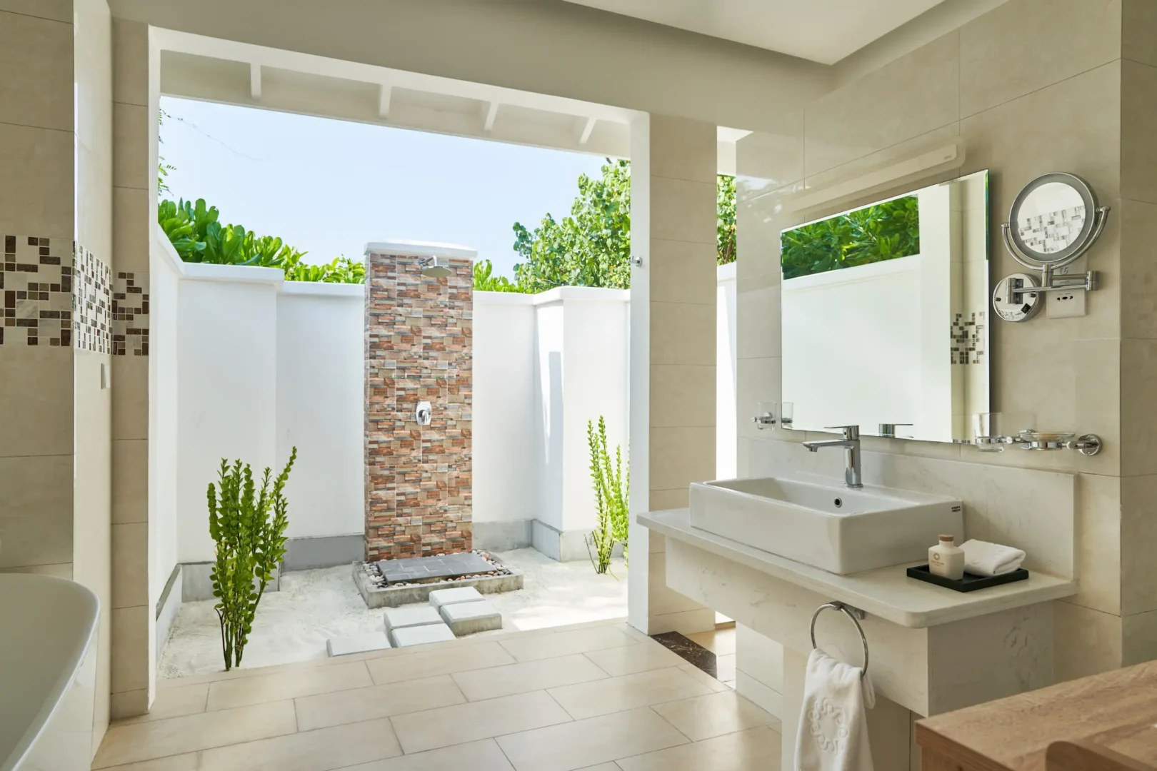 siyam world maldives beach suite with pool bathroom featuring elegant tropical luxury design