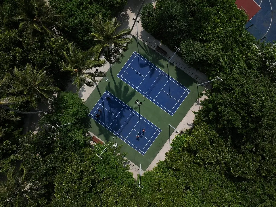 siyam world maldives courts offering modern island sports facilities with vibrant tropical surroundings and active outdoor experiences