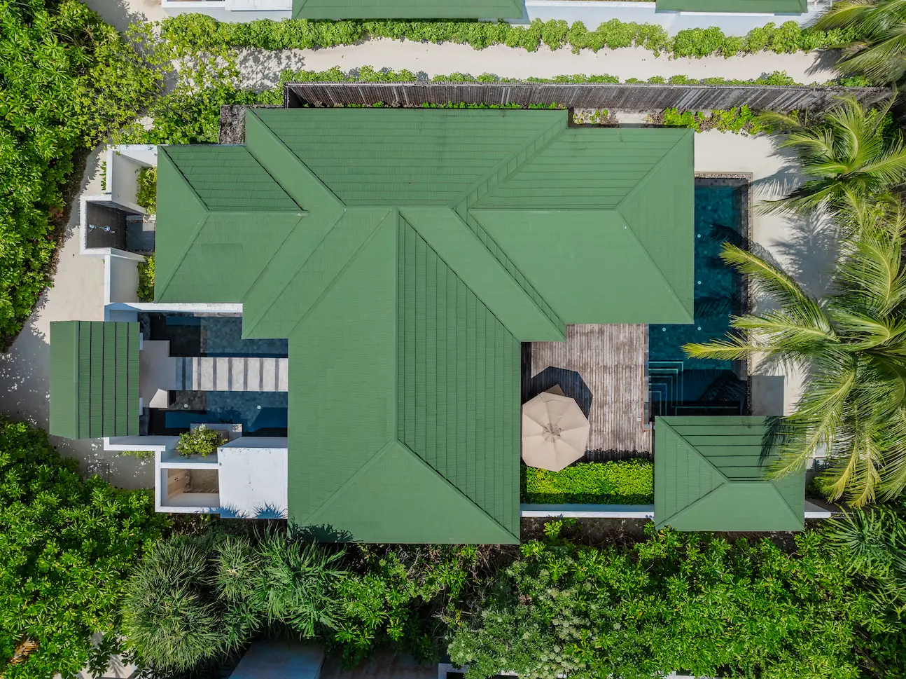 siyam world maldives grand beach residence with pool aerial view showcasing expansive beachfront luxury