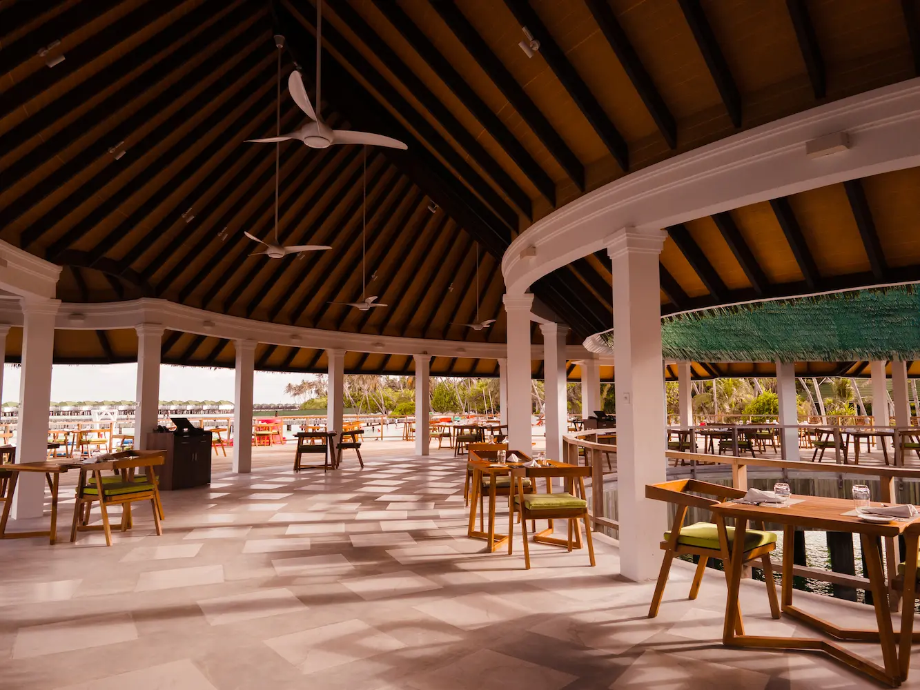siyam world maldives kurry leaf interior showcasing elegant indian dining with warm coastal design and ambient island lighting
