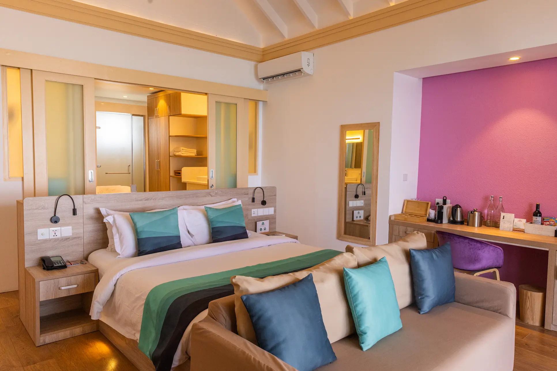 siyam world maldives lagoon villa with pool slide bedroom featuring serene overwater luxury design