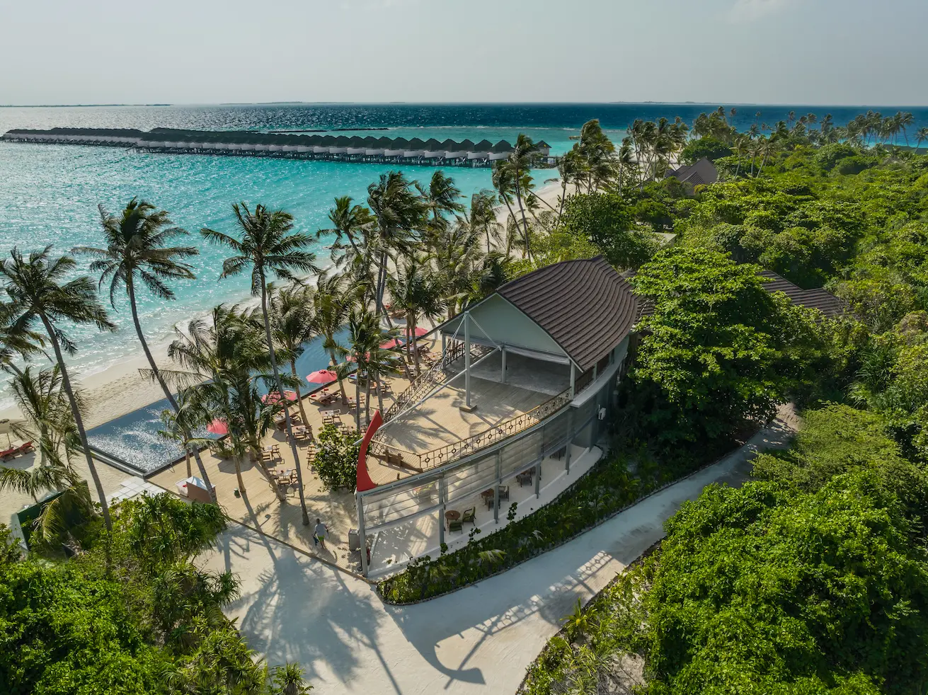 siyam world maldives shipwreck beach bar offering rustic island ambience with oceanfront views and relaxed coastal seating