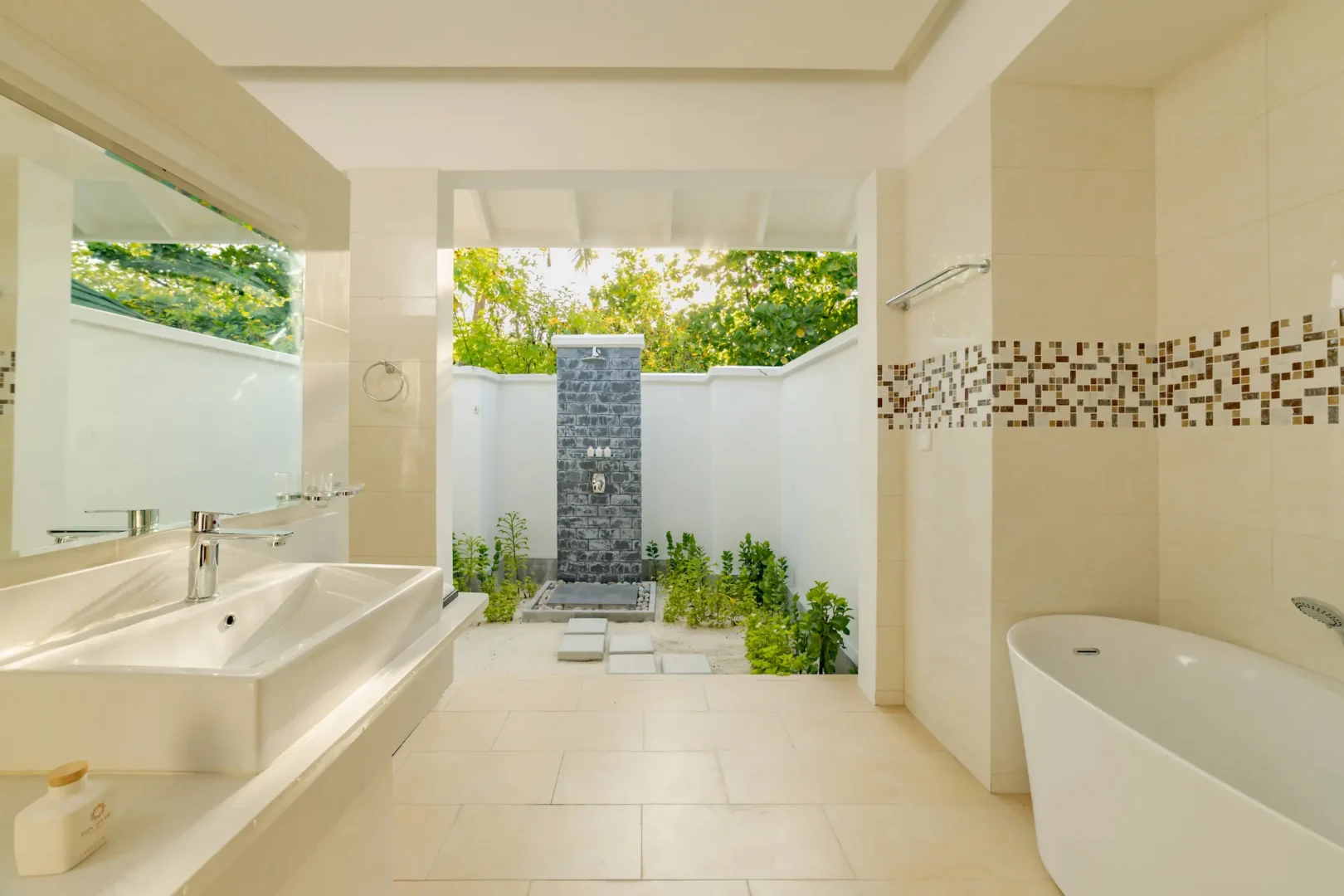 siyam world maldives sunset pool beach villa bathroom with elegant open air luxury design