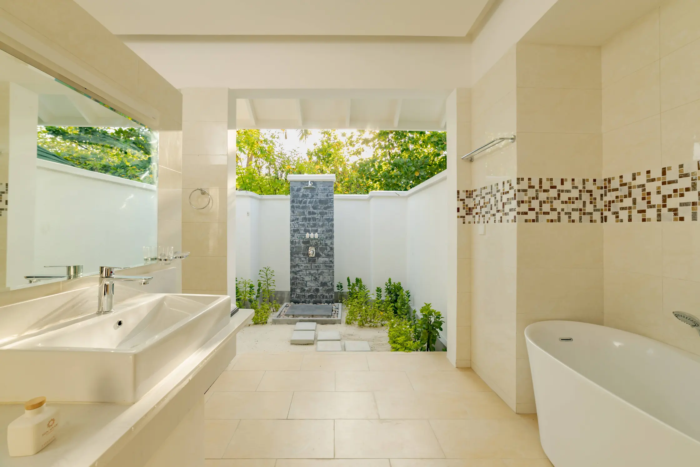 siyam world maldives sunset pool beach villa bathroom with elegant open air luxury design
