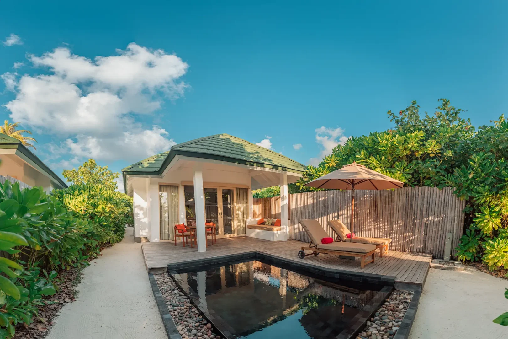 siyam world maldives sunset pool beach villa exterior with private beachfront luxury