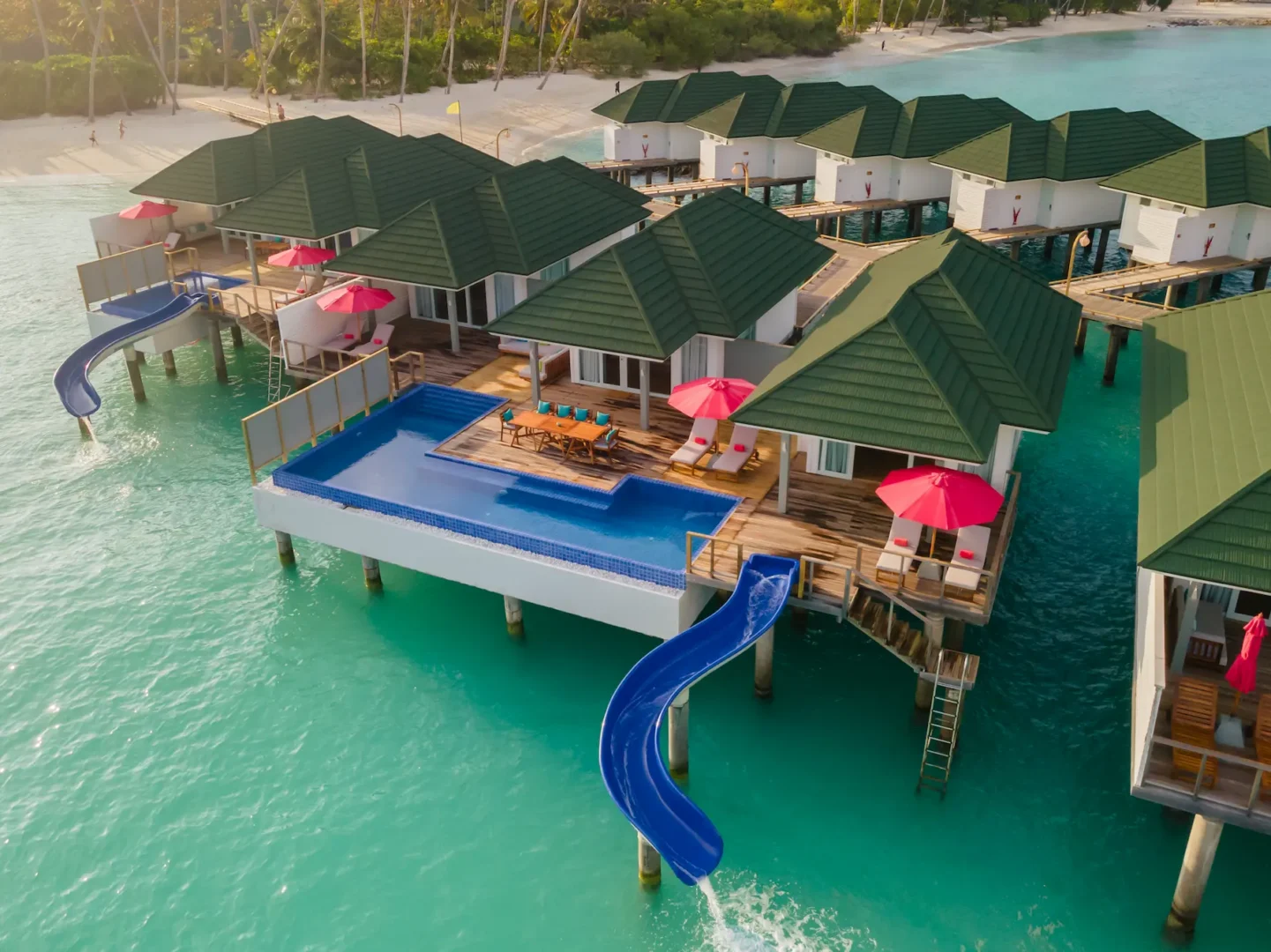 siyam world maldives three bedroom lagoon villa with pool slide aerial view showcasing expansive overwater luxury