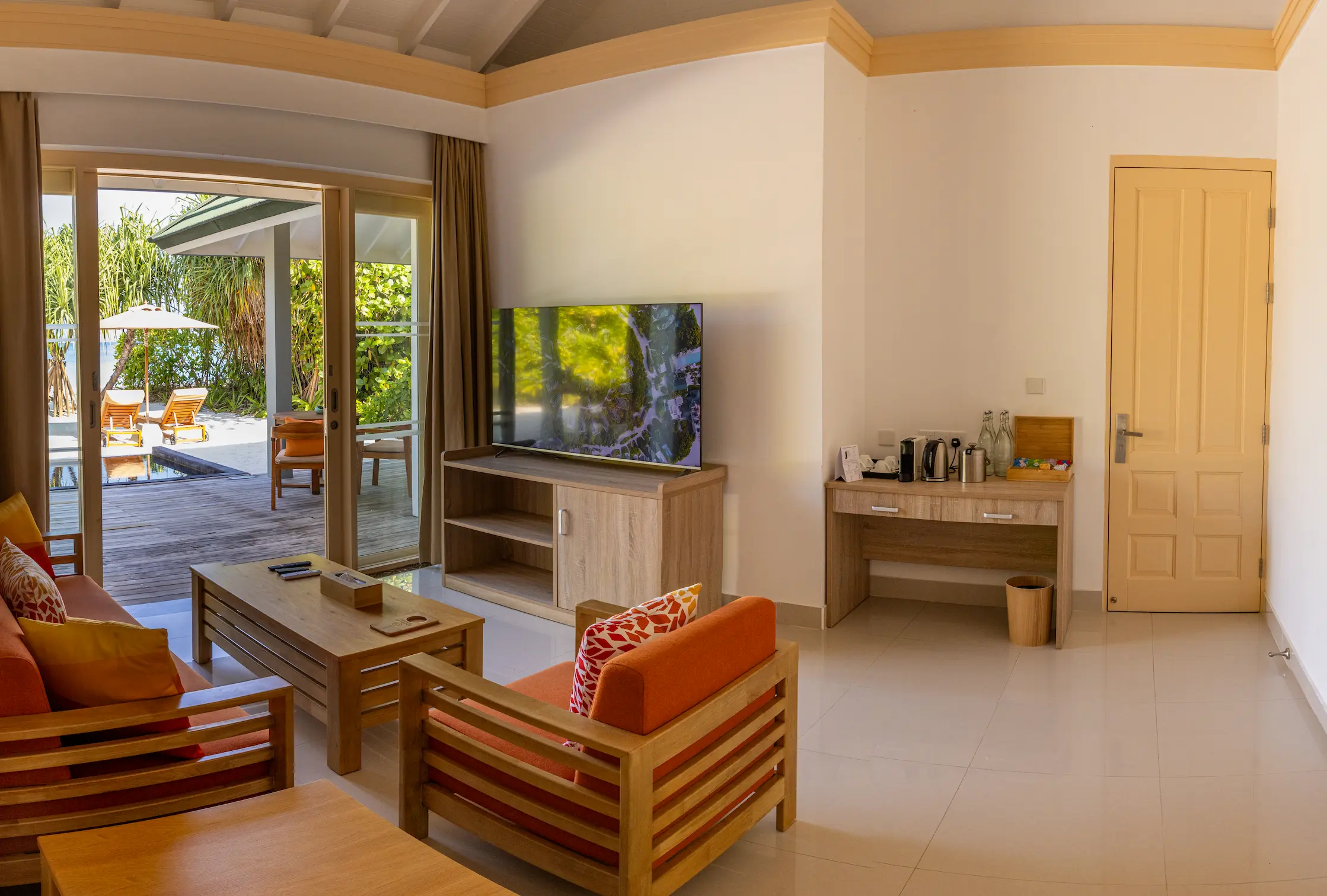 siyam world maldives three bedroom pool beach villa living area featuring spacious beachfront luxury
