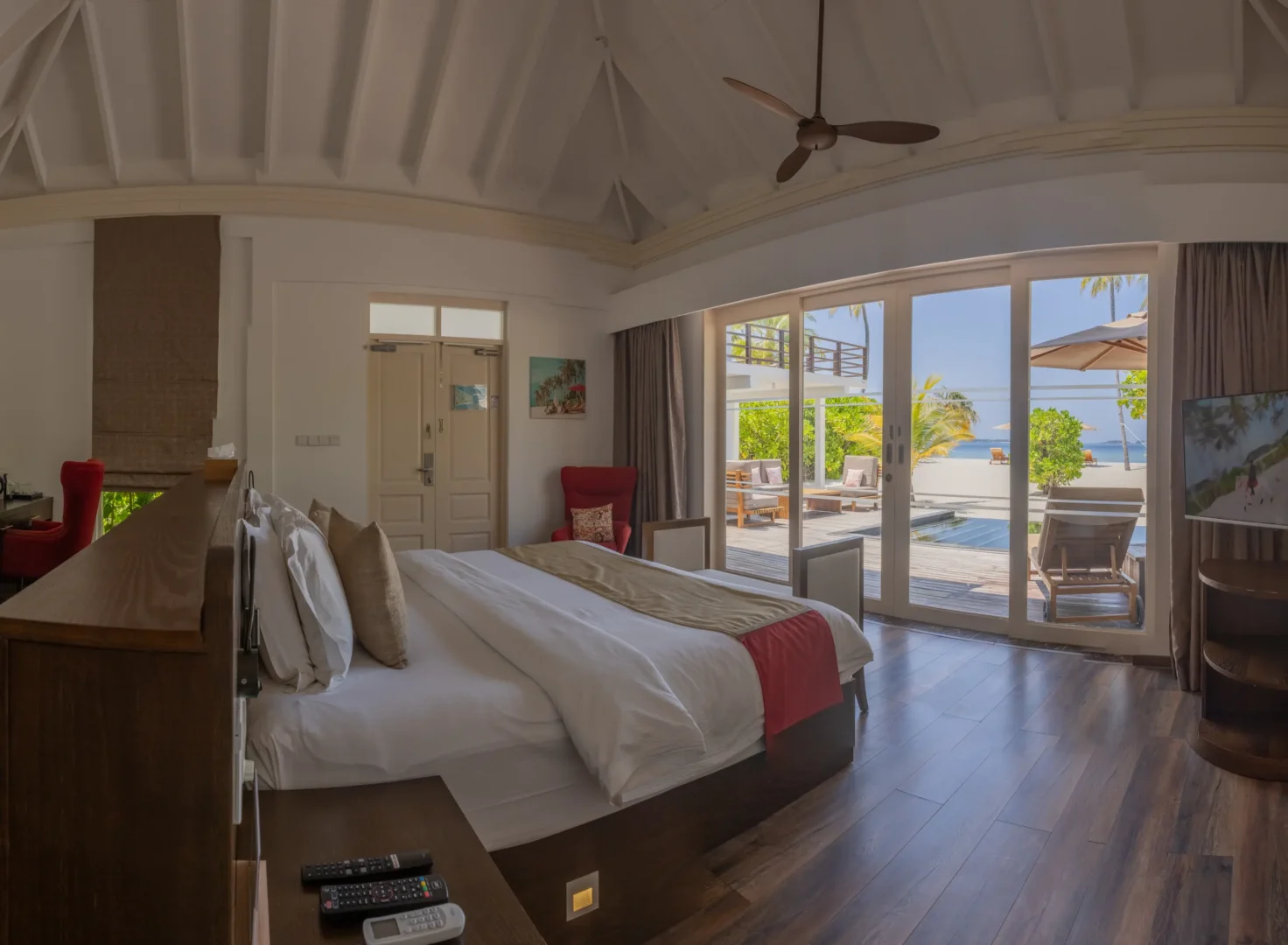 siyam world maldives two bedroom beach residence with pool bedroom featuring refined tropical luxury interior