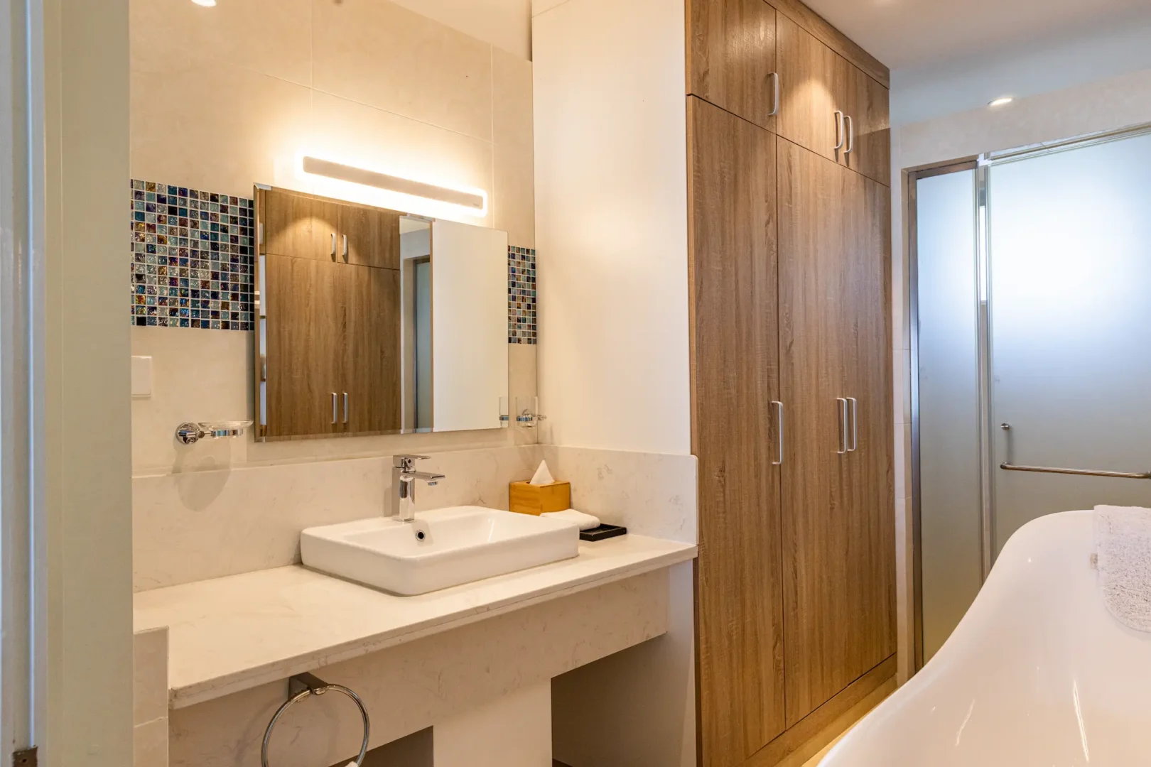 siyam world maldives two bedroom lagoon villa with pool slide bathroom featuring refined overwater luxury