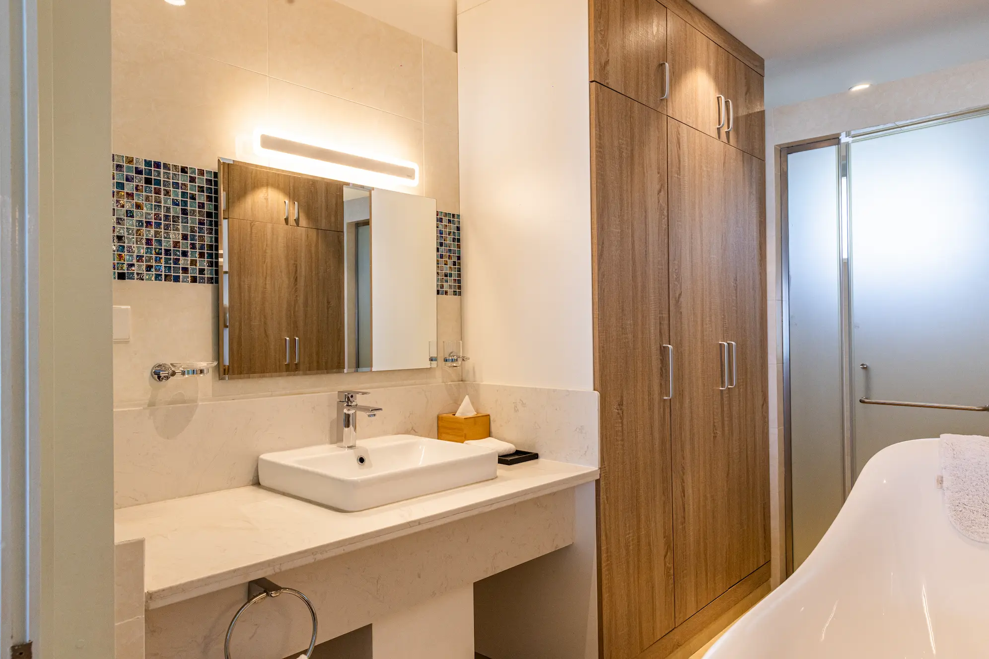 siyam world maldives two bedroom lagoon villa with pool slide bathroom featuring refined overwater luxury