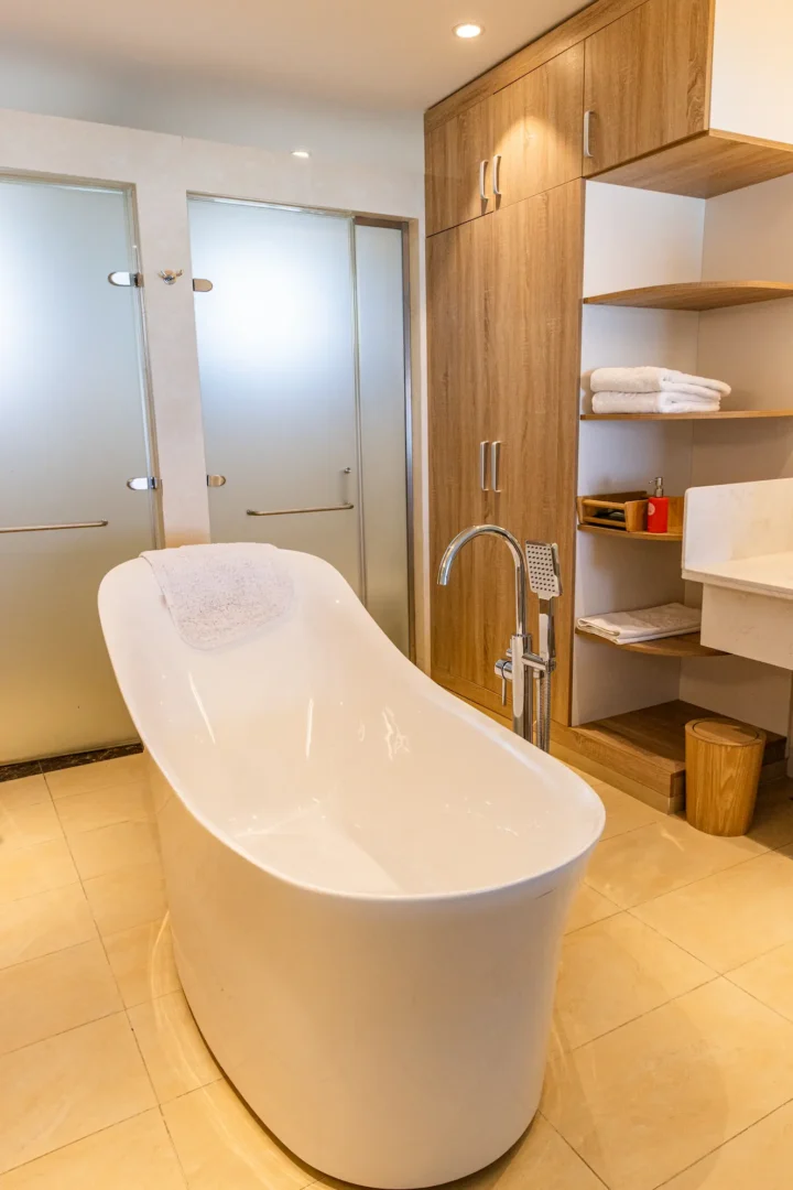 siyam world maldives two bedroom lagoon villa with pool slide bathtub offering serene overwater luxury