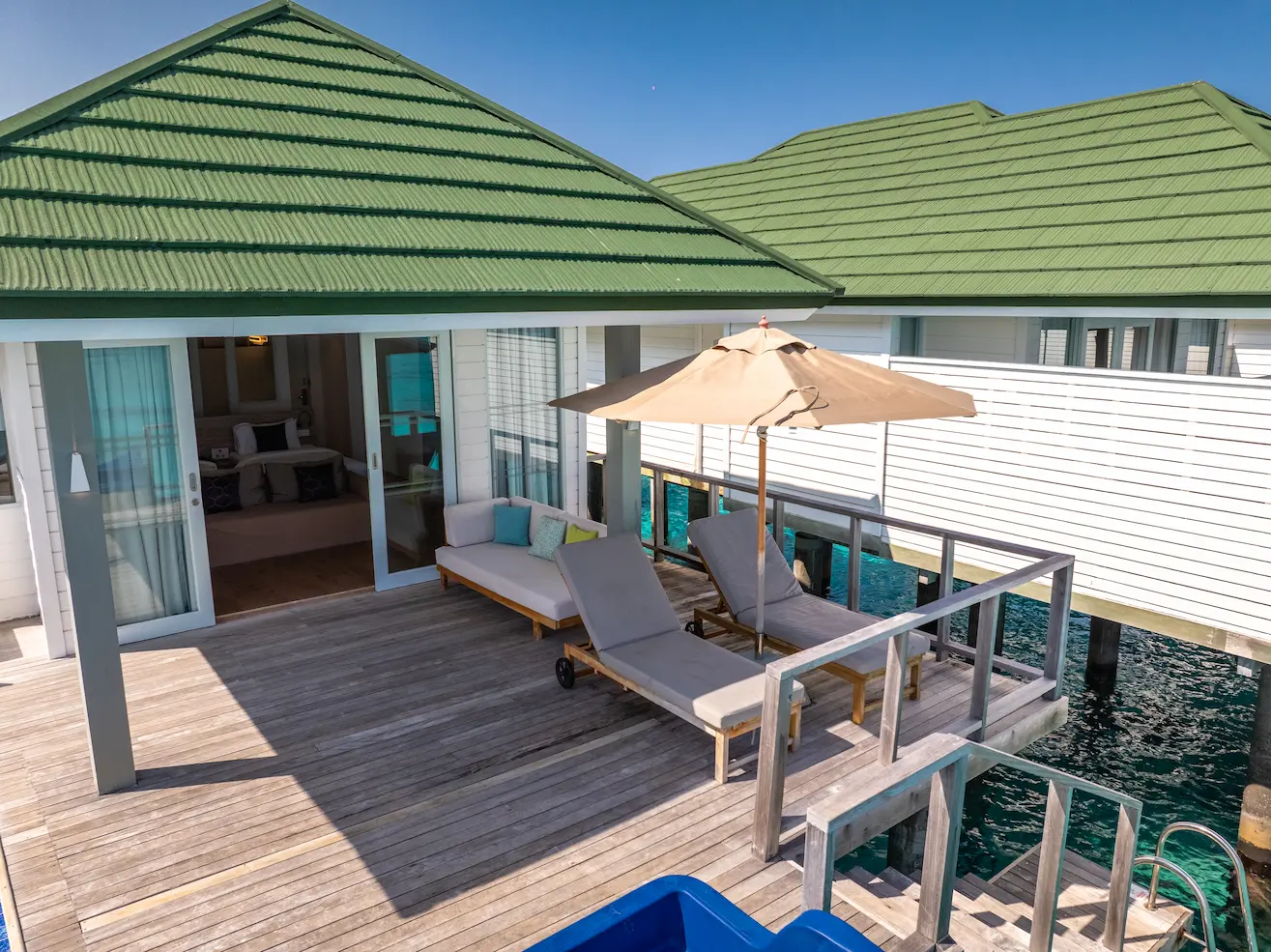 siyam world maldives two bedroom lagoon villa with pool slide terrace offering serene overwater luxury