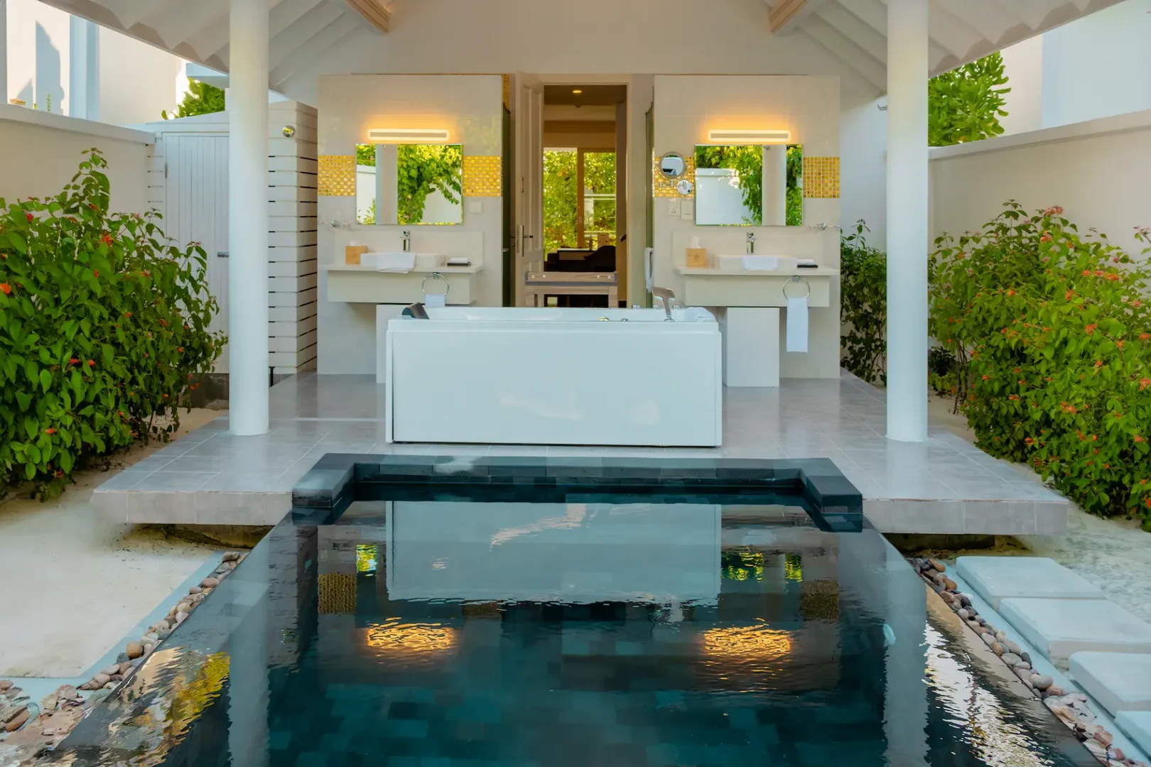 siyam world maldives two storey beach residence with pool bathroom featuring spacious tropical luxury design