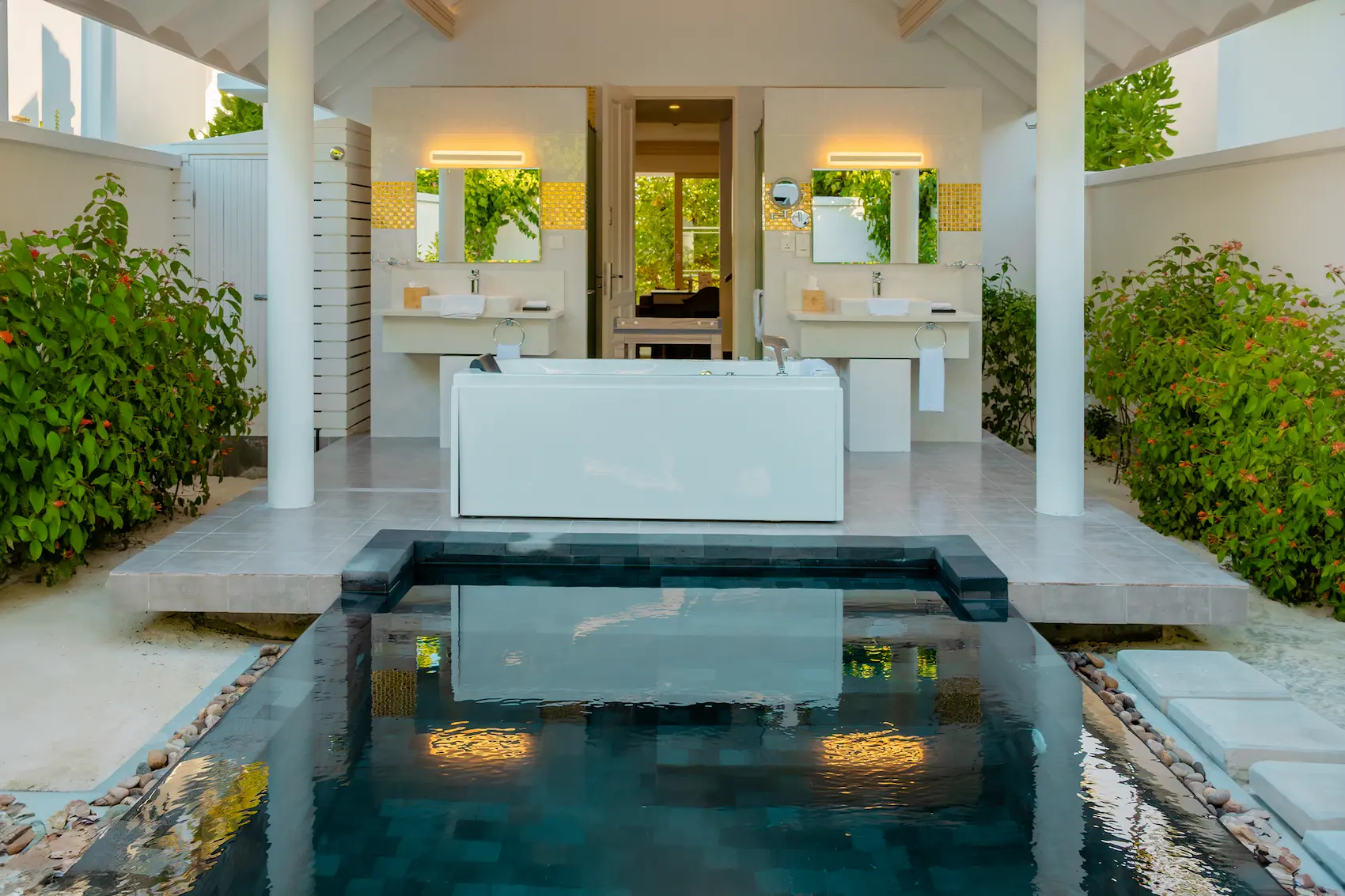 siyam world maldives two storey beach residence with pool bathroom featuring spacious tropical luxury design