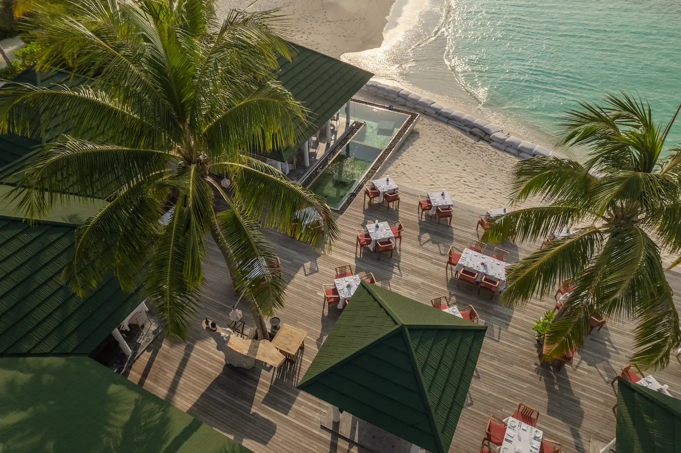 siyam world maldives wahoo beachfront bar offering relaxed island vibes with oceanfront seating and tropical cocktails