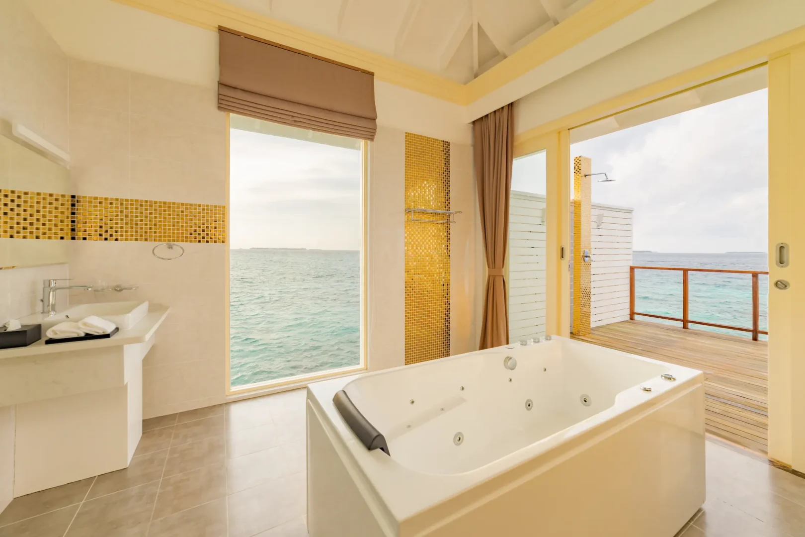 siyam world maldives water pavilion bathroom view with serene overwater luxury