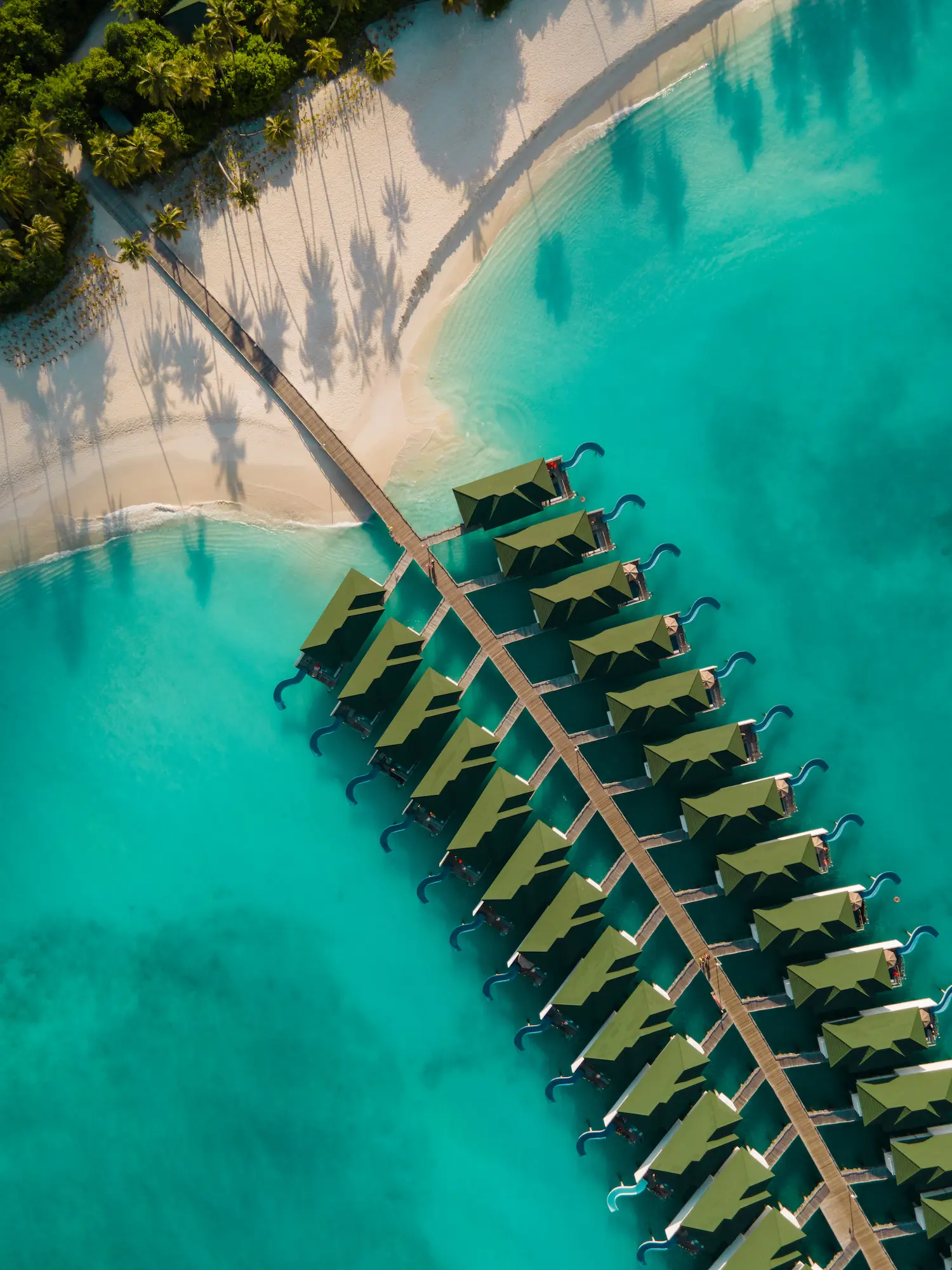 siyam world maldives water villa aerial view over turquoise lagoon