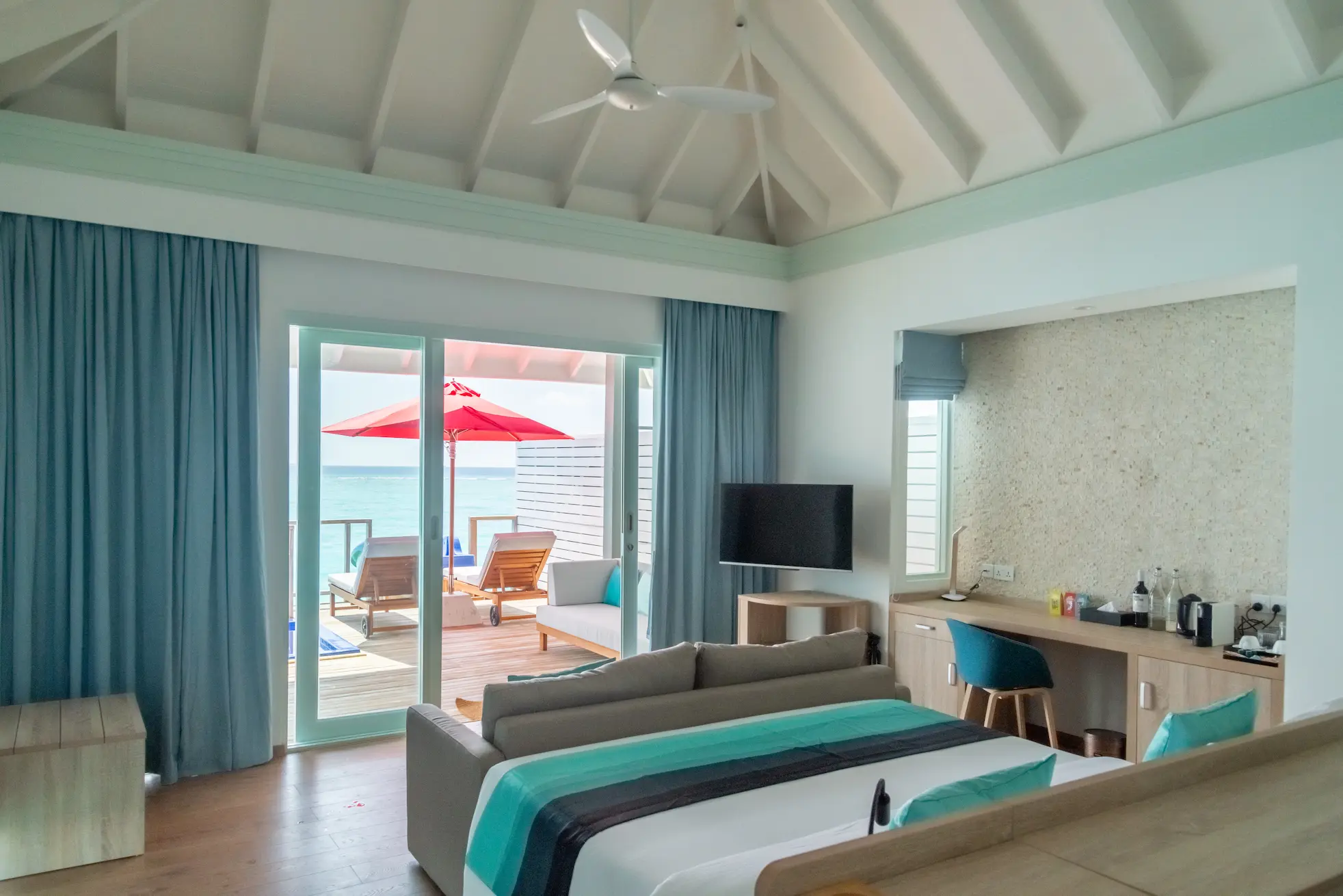 siyam world maldives water villa with pool slide bed with view