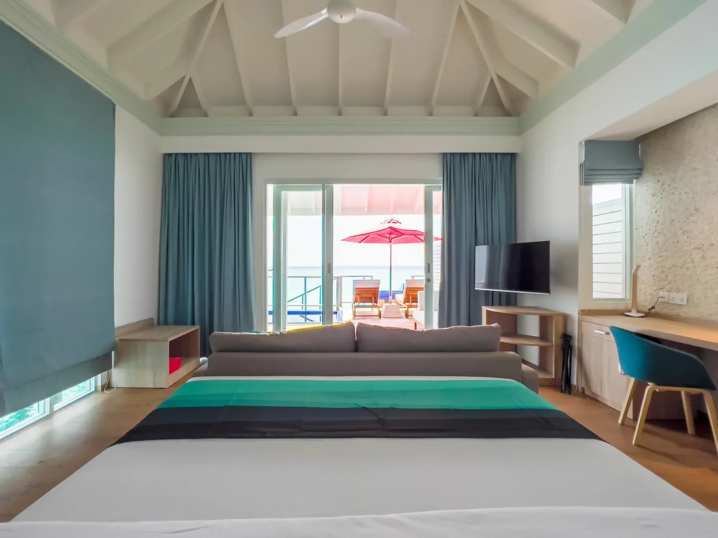 siyam world maldives water villa with pool slide interior showcasing spacious overwater luxury design and serene ocean views