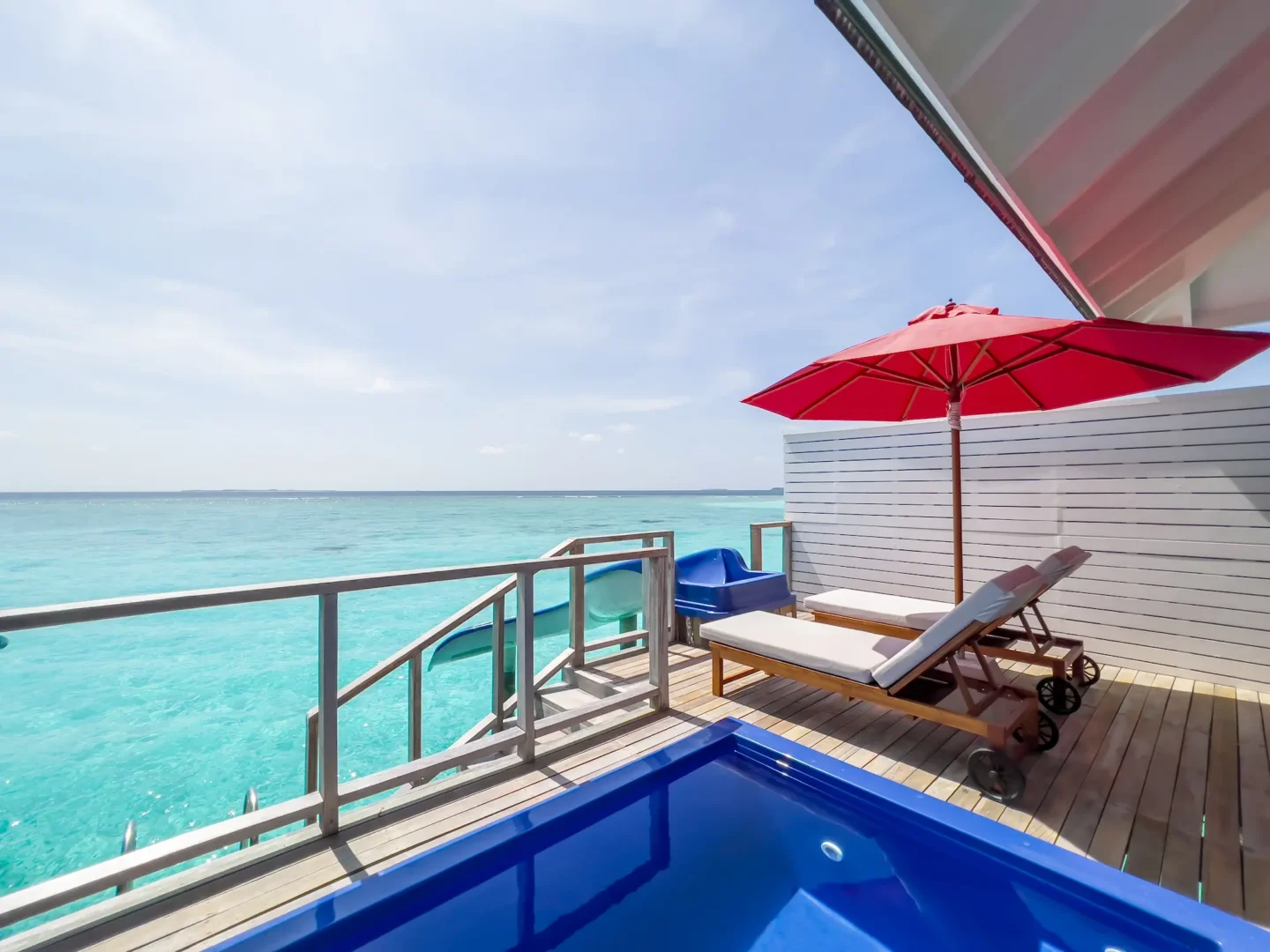 siyam world maldives water villa with pool slide into water