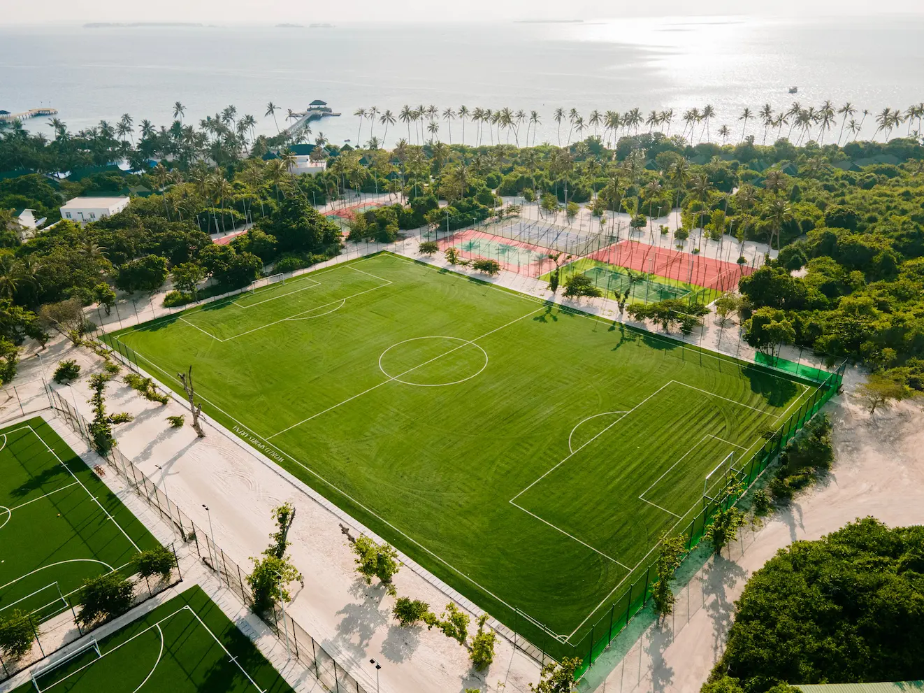 siyam world maldives world sports arena football field offering professional quality island pitch with lush turf and vibrant tropical surroundings