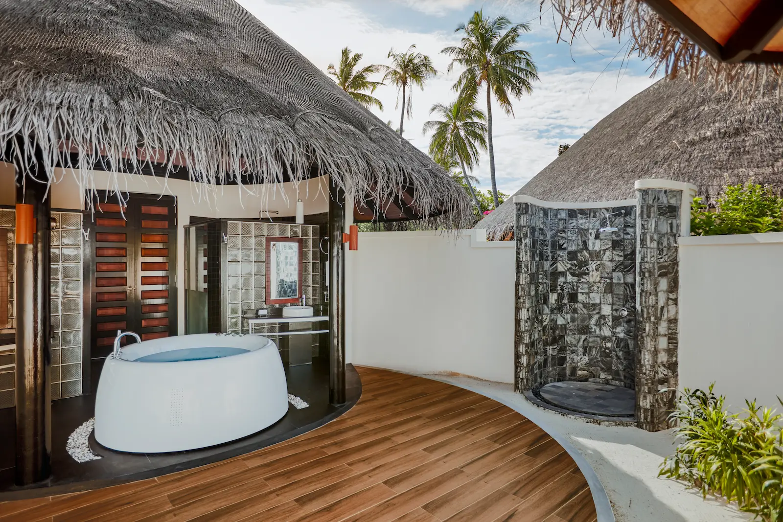 luxury deluxe beach villa shower at sun siyam iru fushi maldives private beachfront accommodation