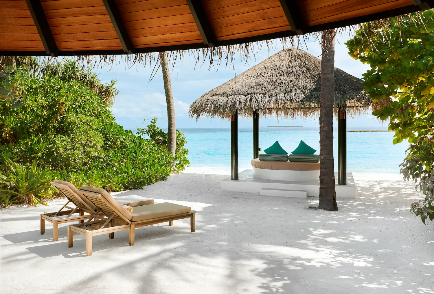 luxury deluxe beach villa with terrace at sun siyam iru fushi maldives beachfront accommodation