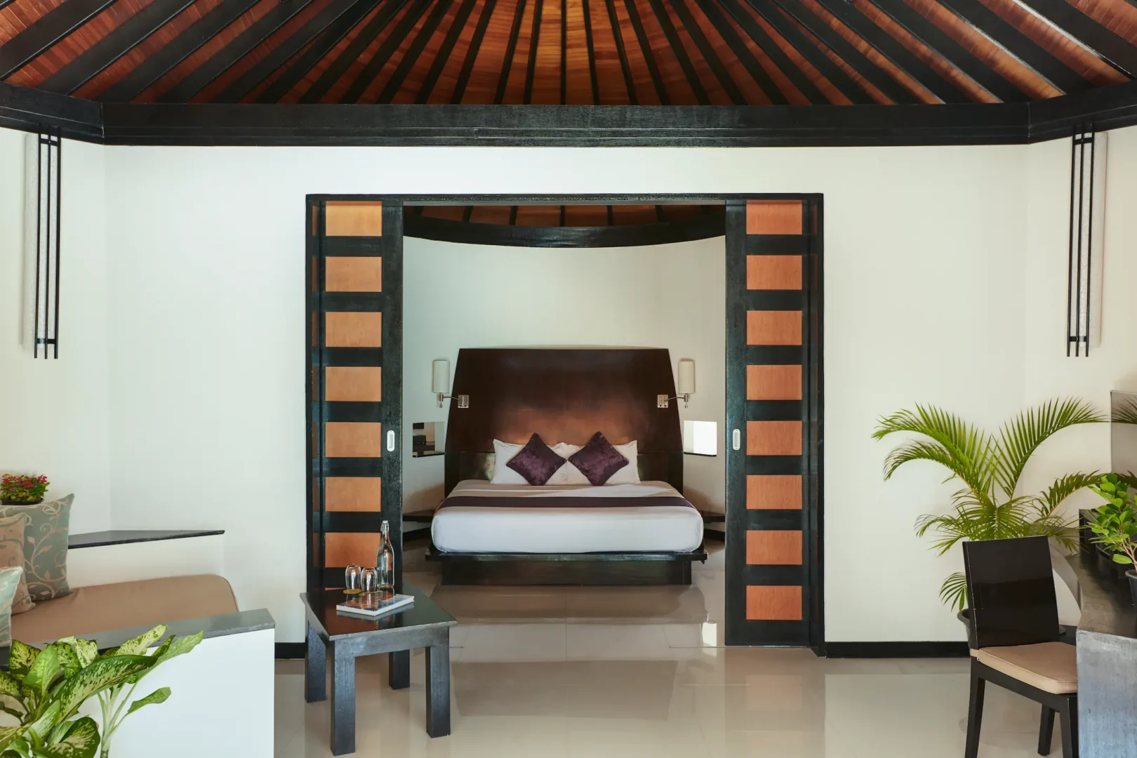 luxury deluxe family beach villa bedroom at sun siyam iru fushi maldives private beachfront accommodation