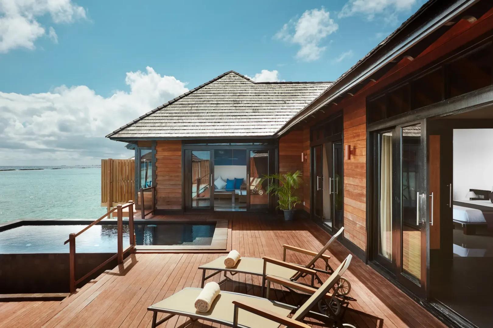 luxury infinity water villa exterior at sun siyam iru fushi maldives overwater accommodation