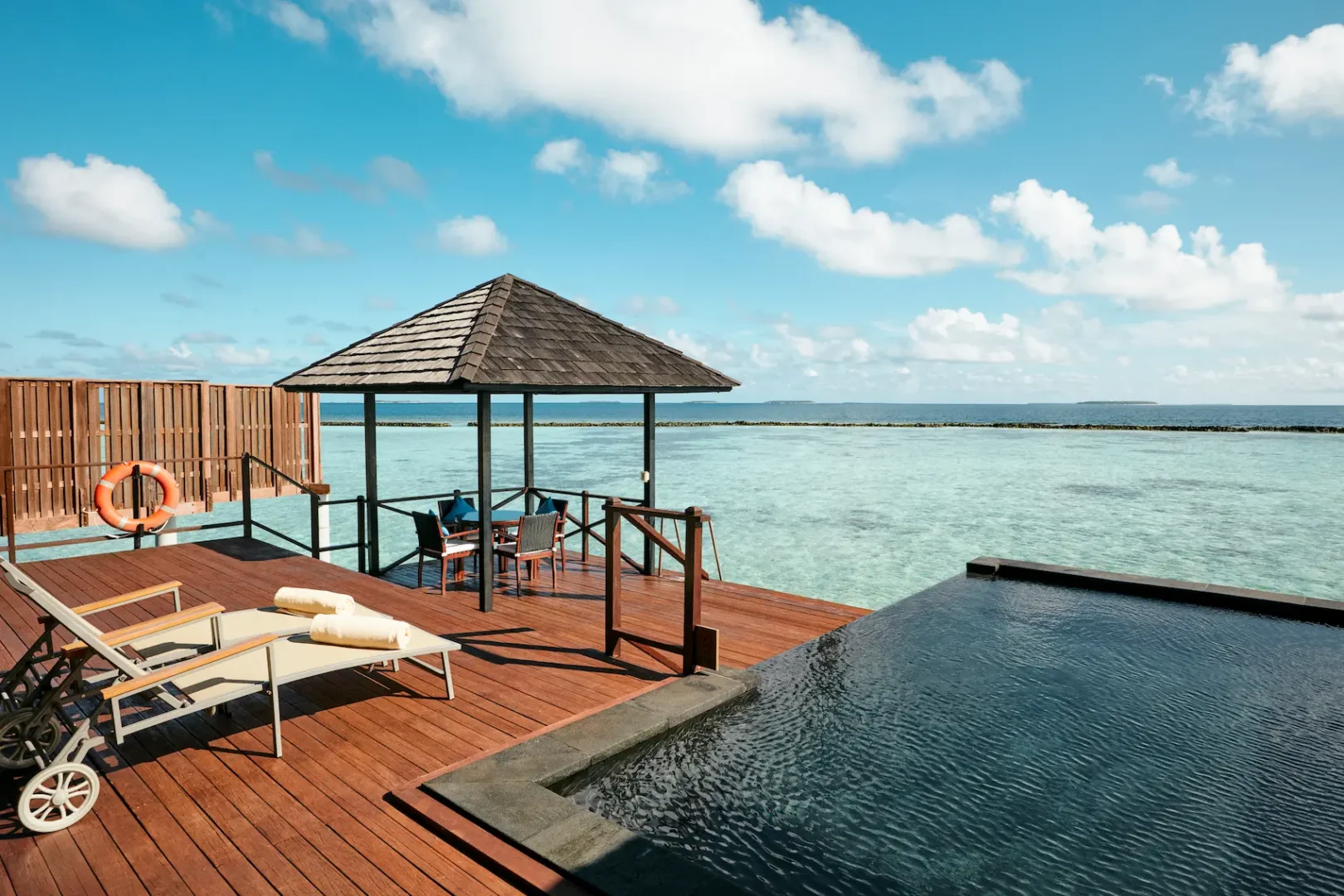 luxury infinity water villa terrace at sun siyam iru fushi maldives overwater accommodation