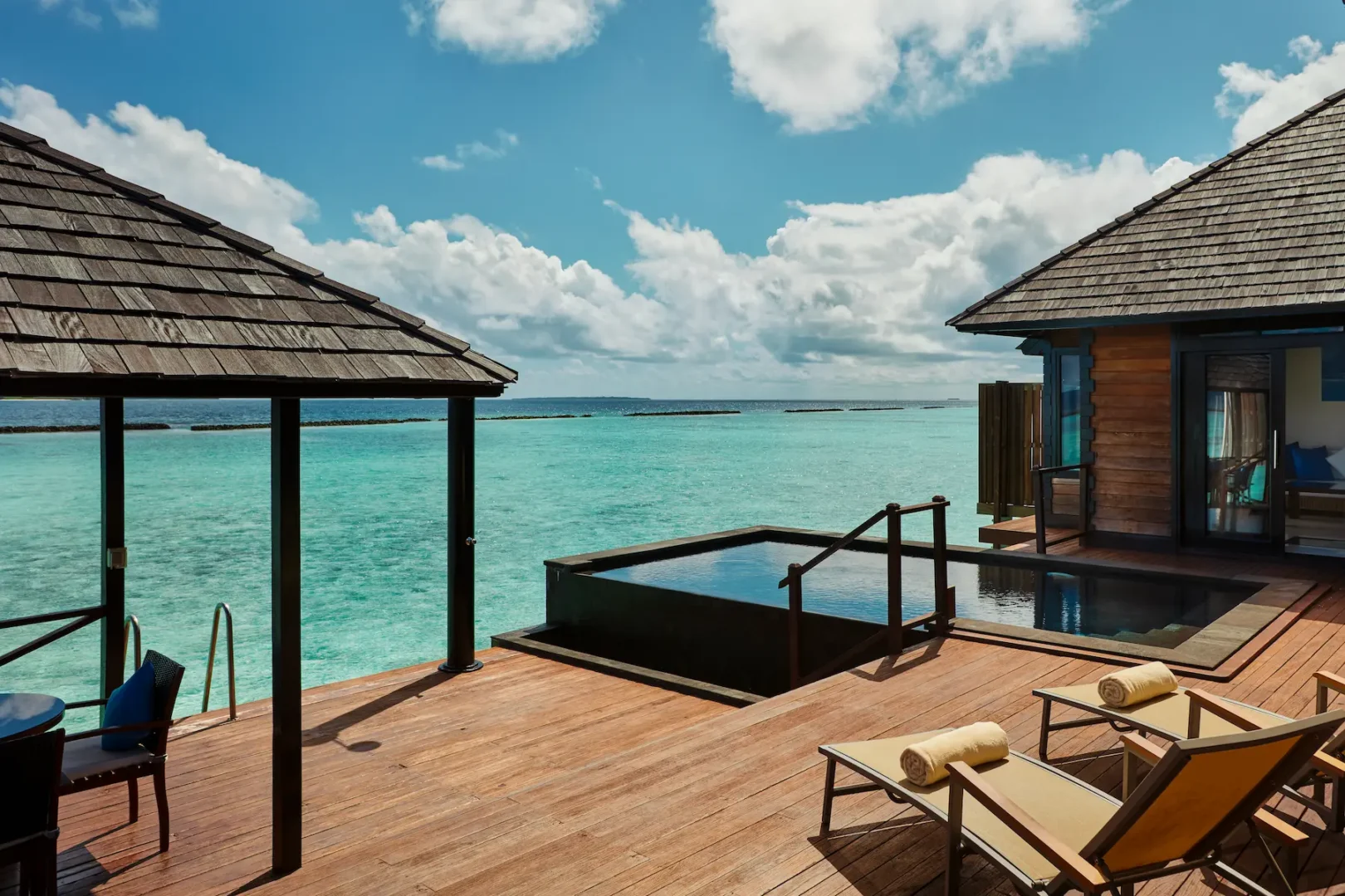 luxury infinity water villa view at sun siyam iru fushi maldives overwater accommodation
