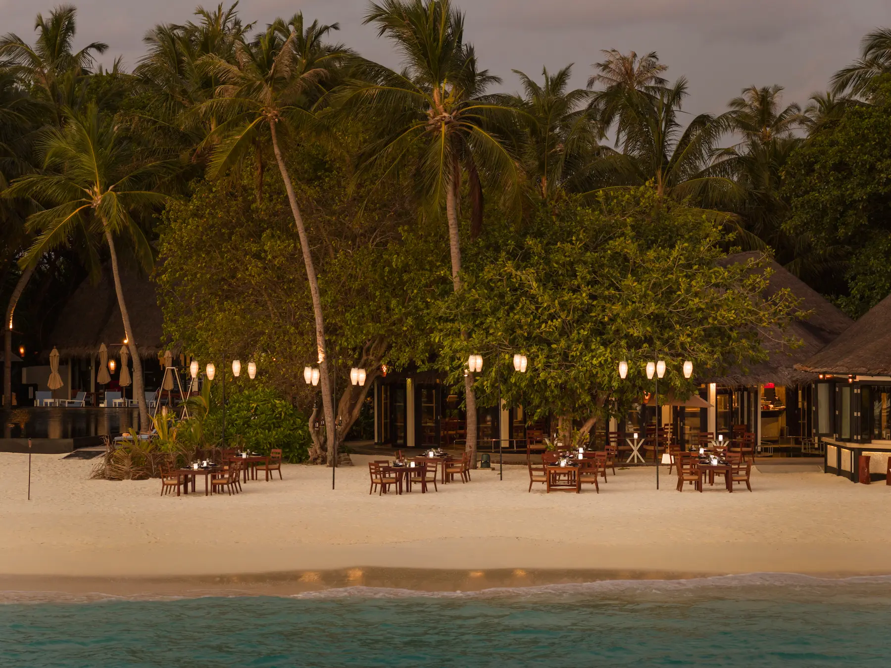 luxury islanders grill exterior at sun siyam iru fushi maldives beachfront dining experience