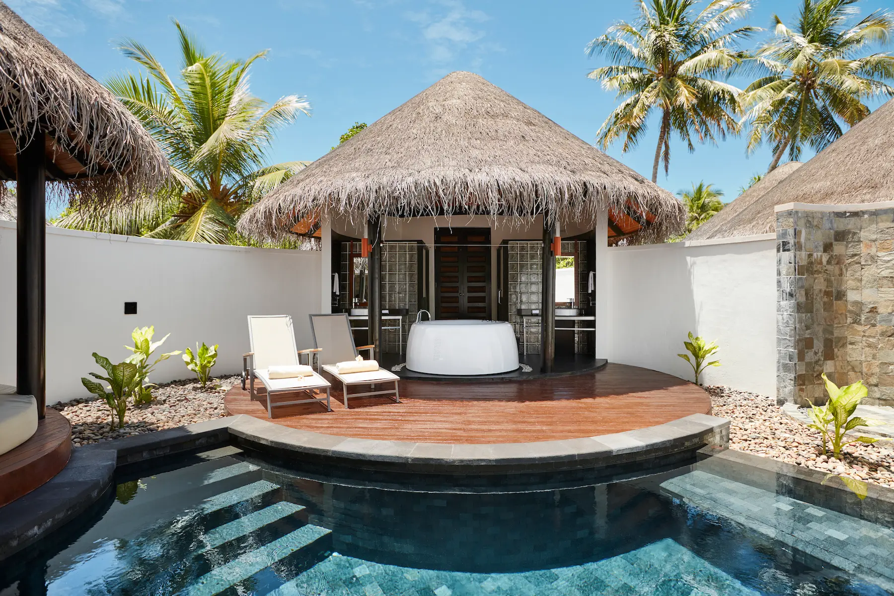 luxury pool beach villa bathroom at sun siyam iru fushi maldives private beachfront accommodation